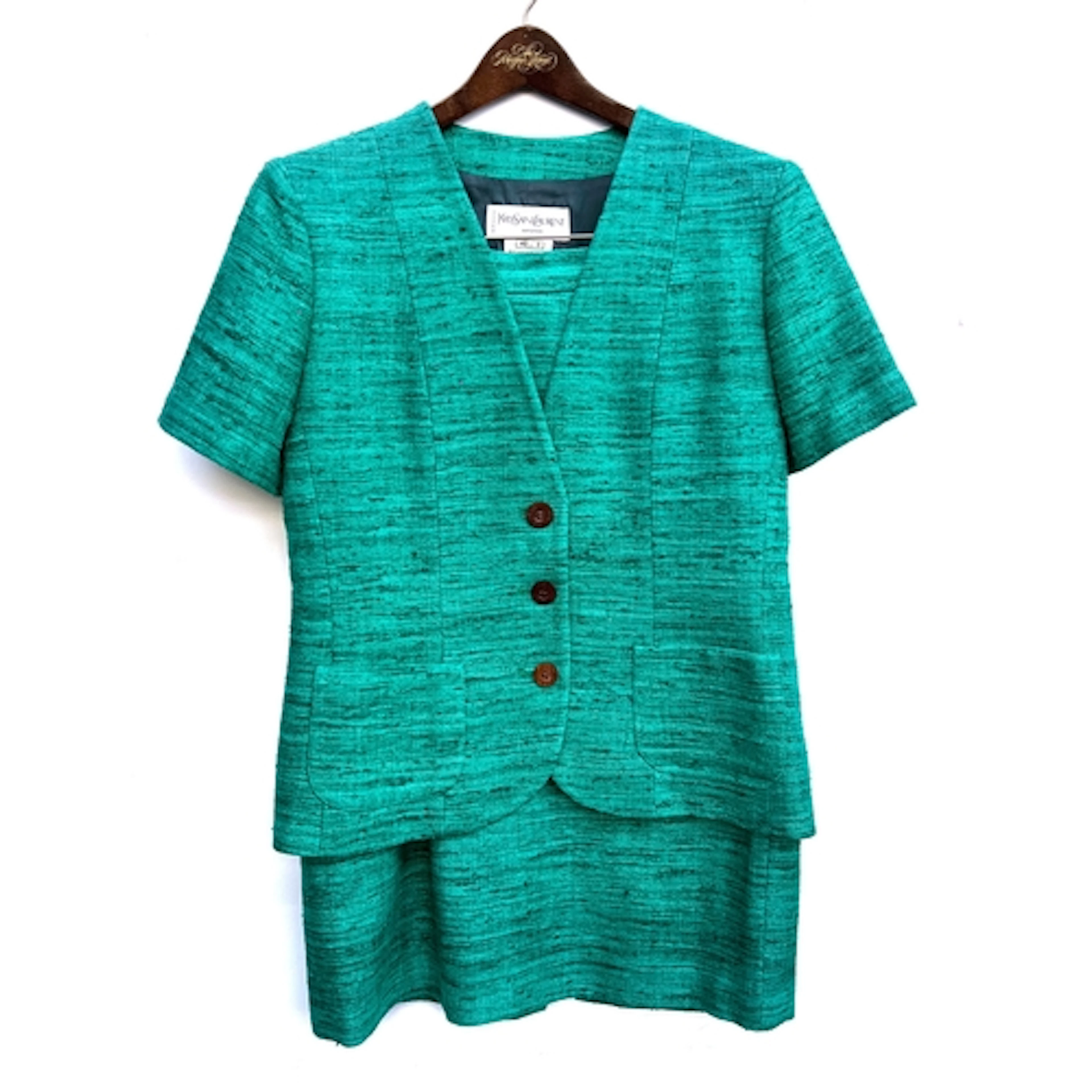 A Yves Saint Laurent green silk jacket and matching skirt, s...