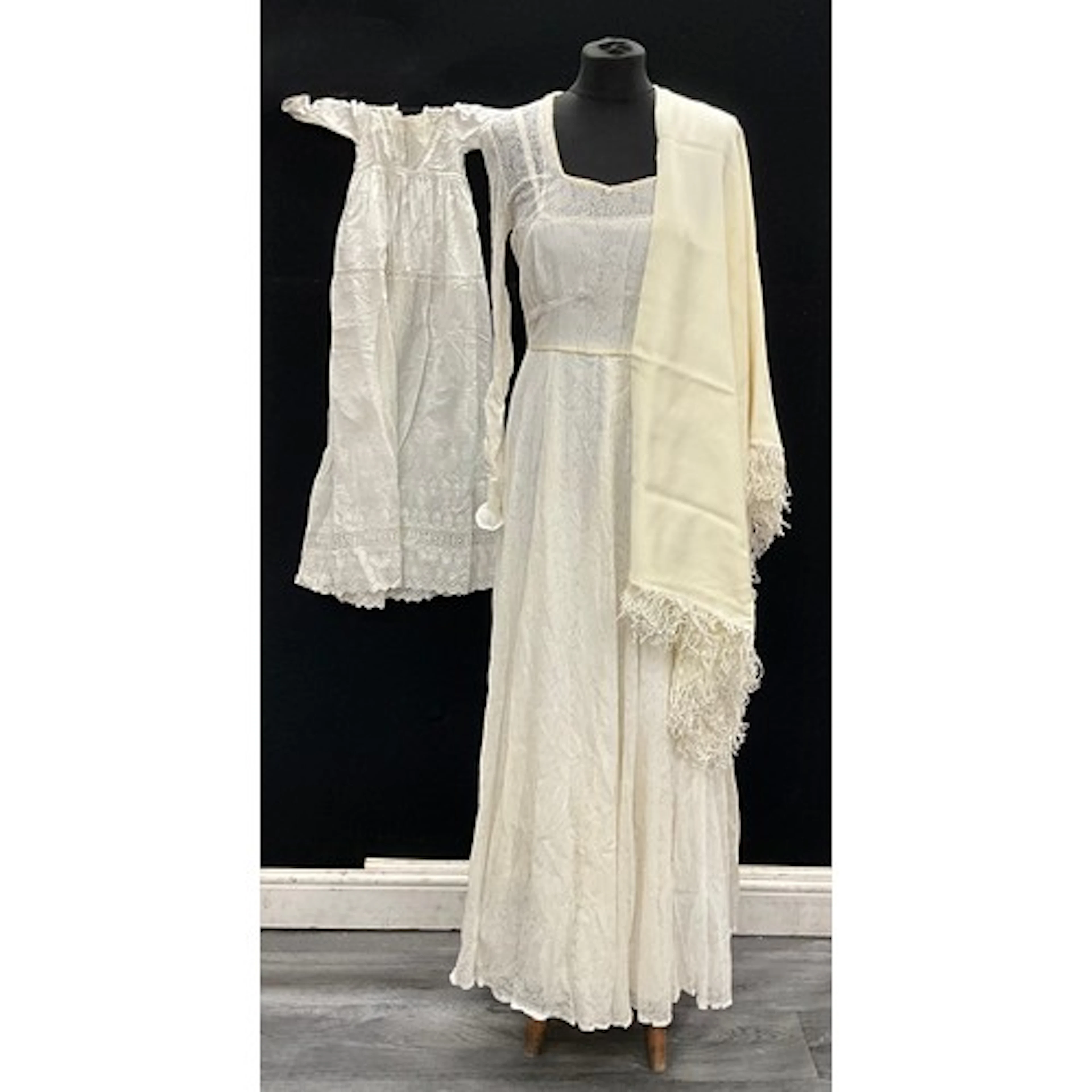 A 1950s lace wedding dress, floral motif to the lace exterio...