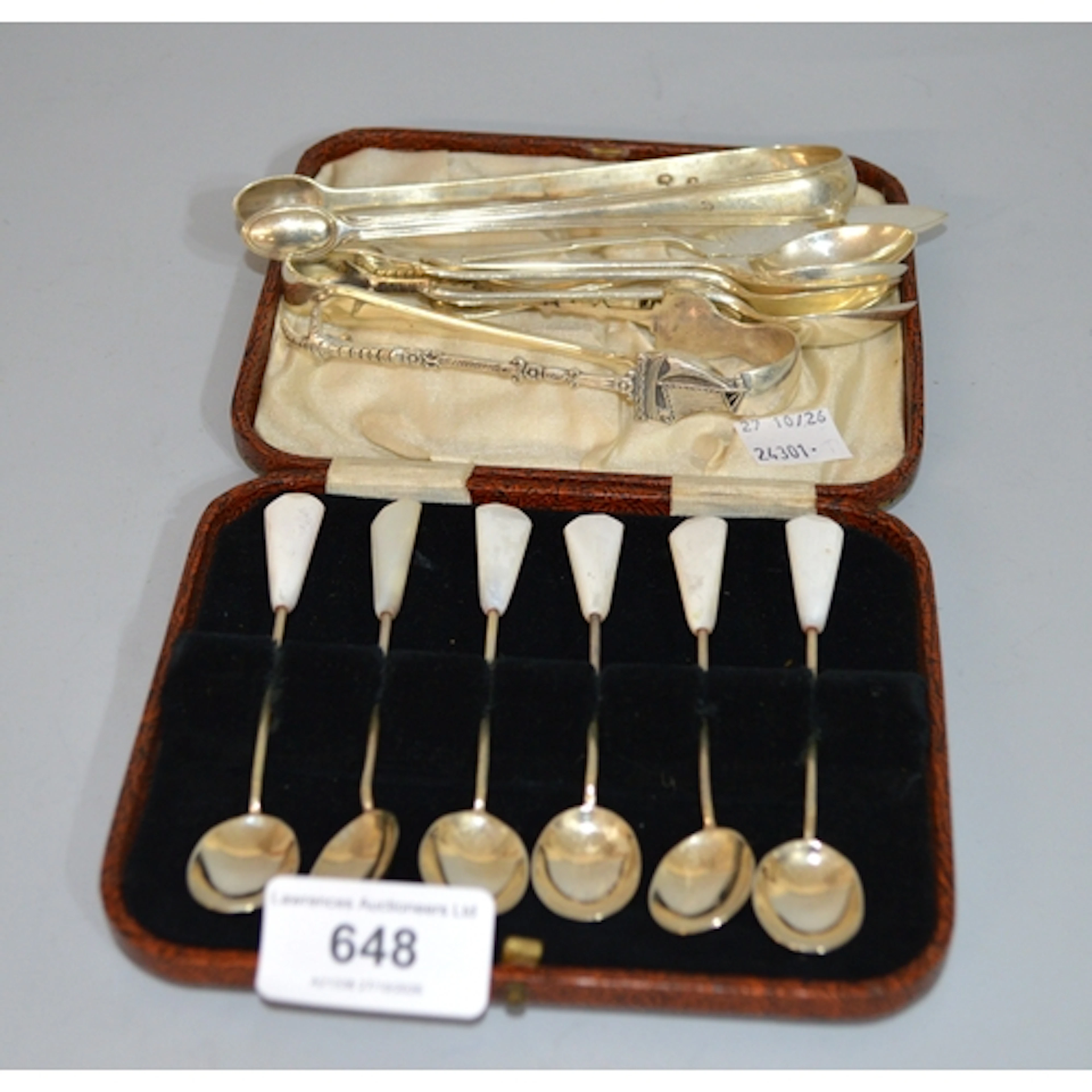 Various silver coffee spoons and tongs, together with a silv...
