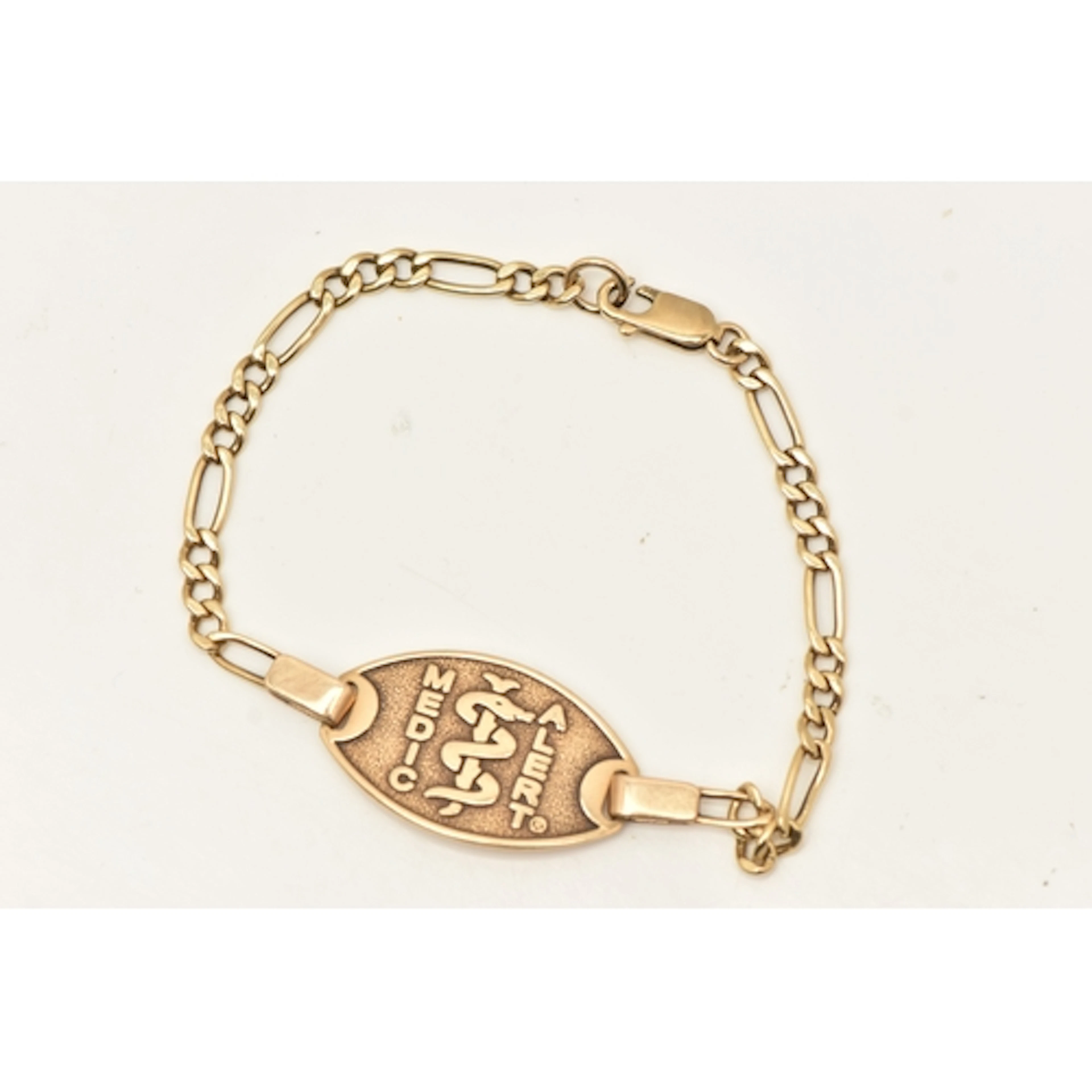 A 9CT YELLOW GOLD MEDICAL BRACELET, fitted with a lobster cl...