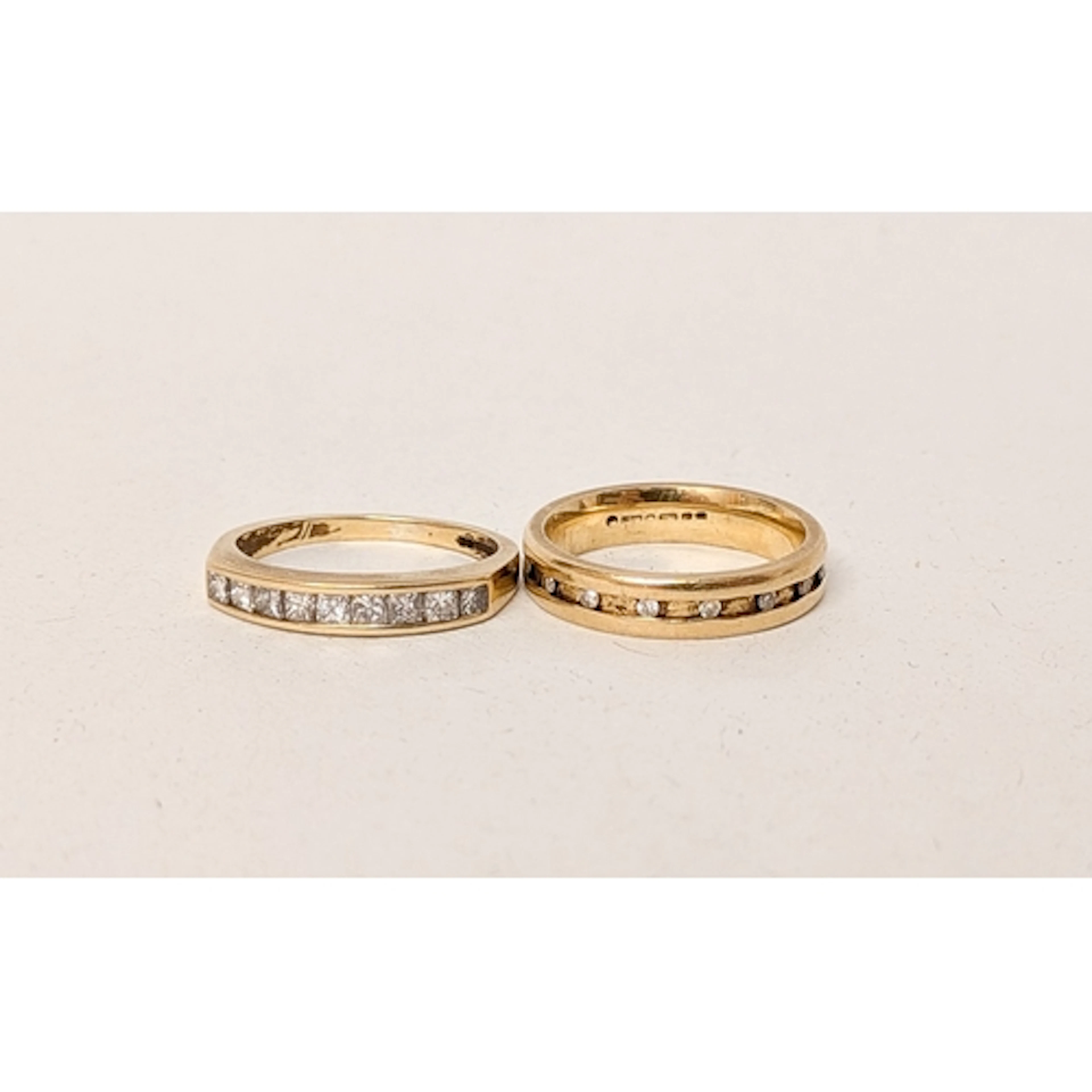 An 18ct gold diamond set yellow gold wedding band and a half...