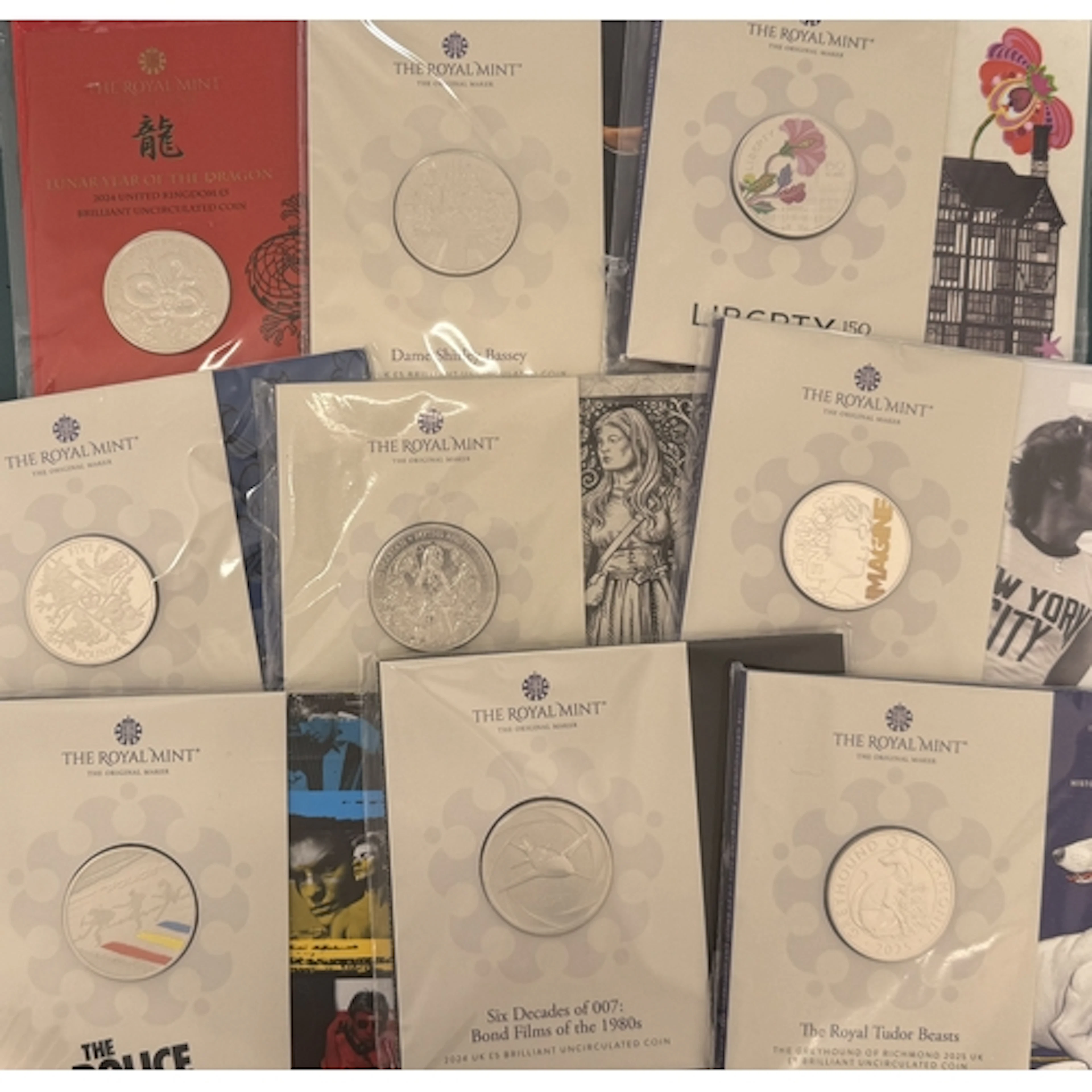 A collection of seventy-two UK King Charles III Royal Mint b...