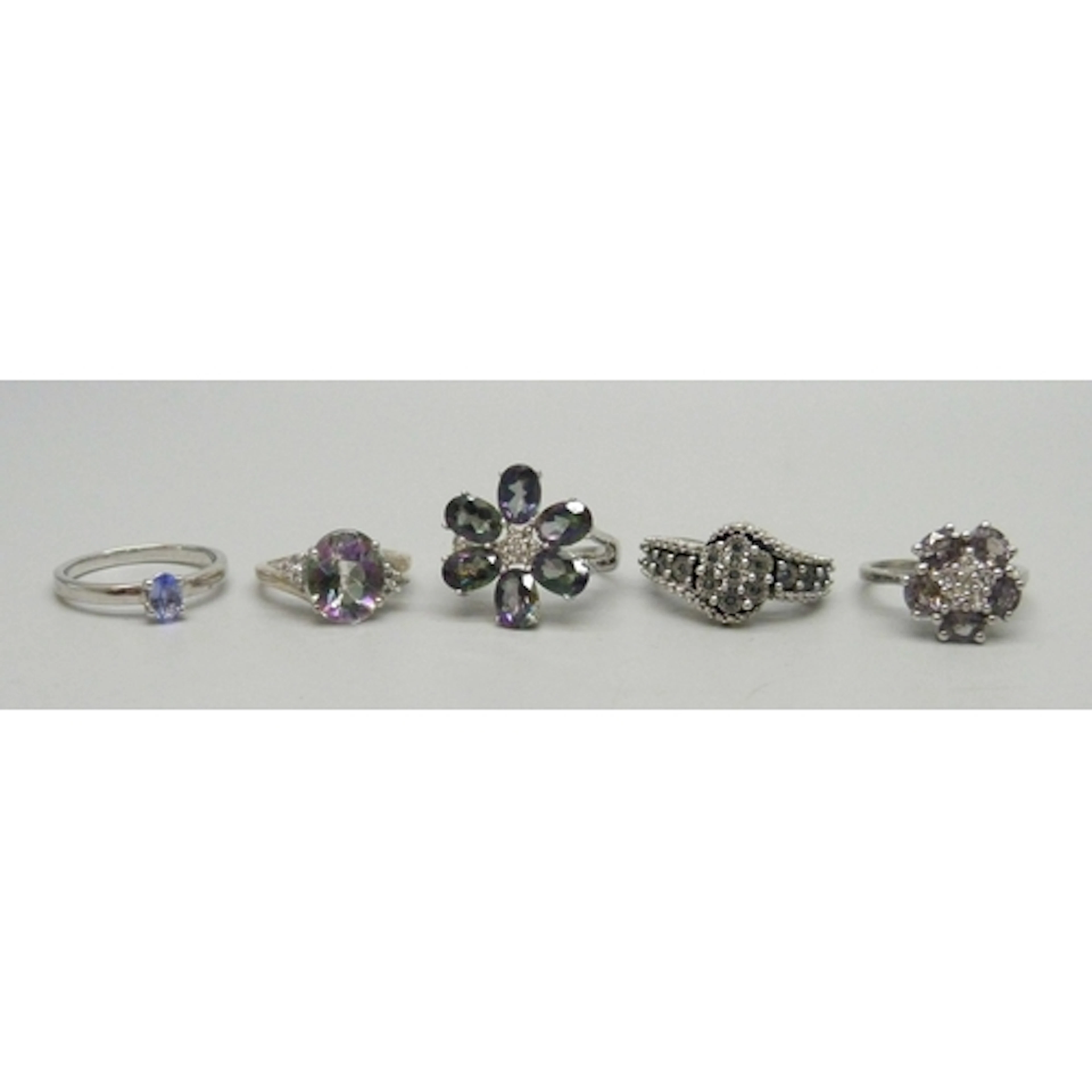 A collection of five TGGC and other gemstone rings, 17g tota...