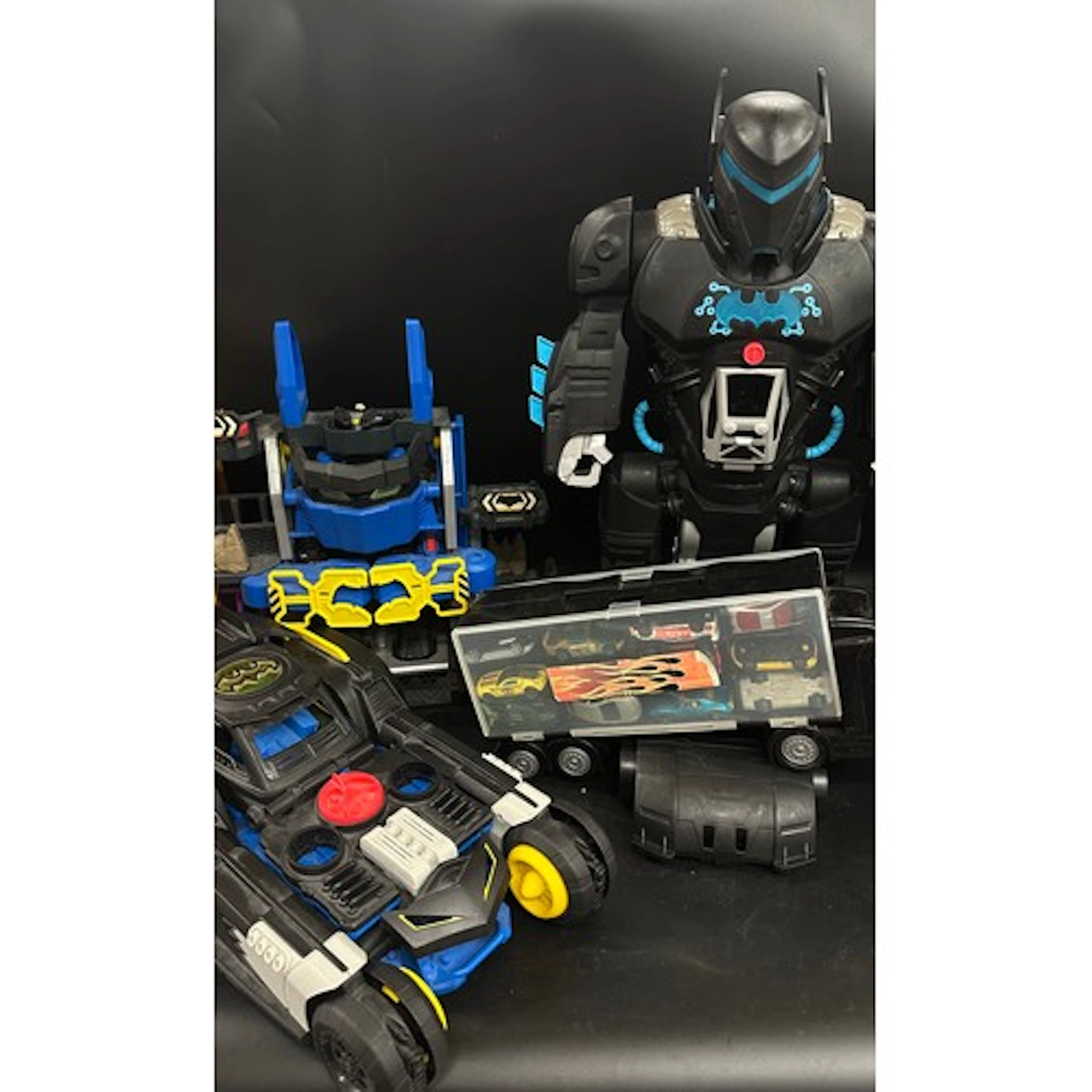 A Batman robot toy, speaks, lights, transforming remote cont...
