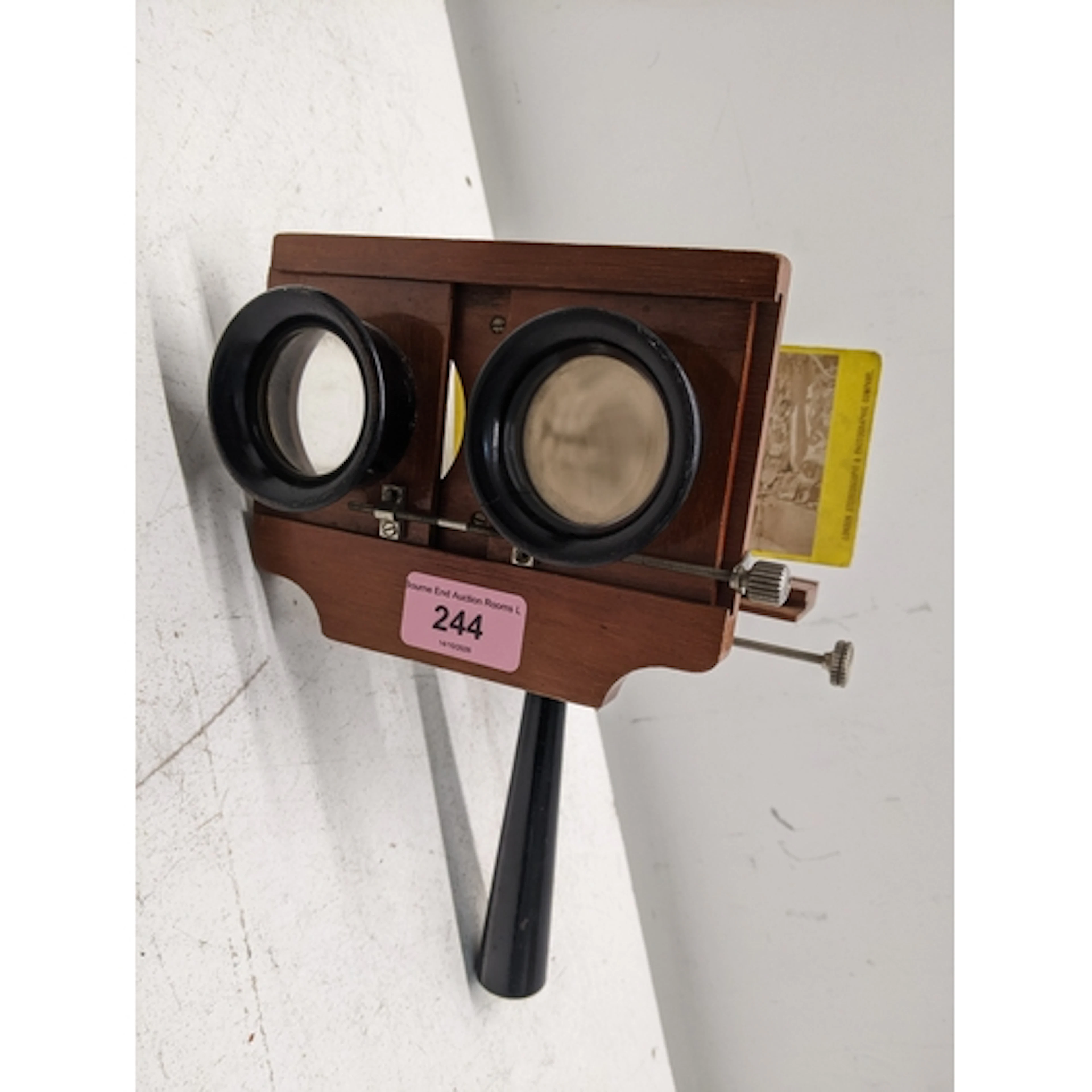 Victorian mahogany stereoscope with ebonized handle and lens...