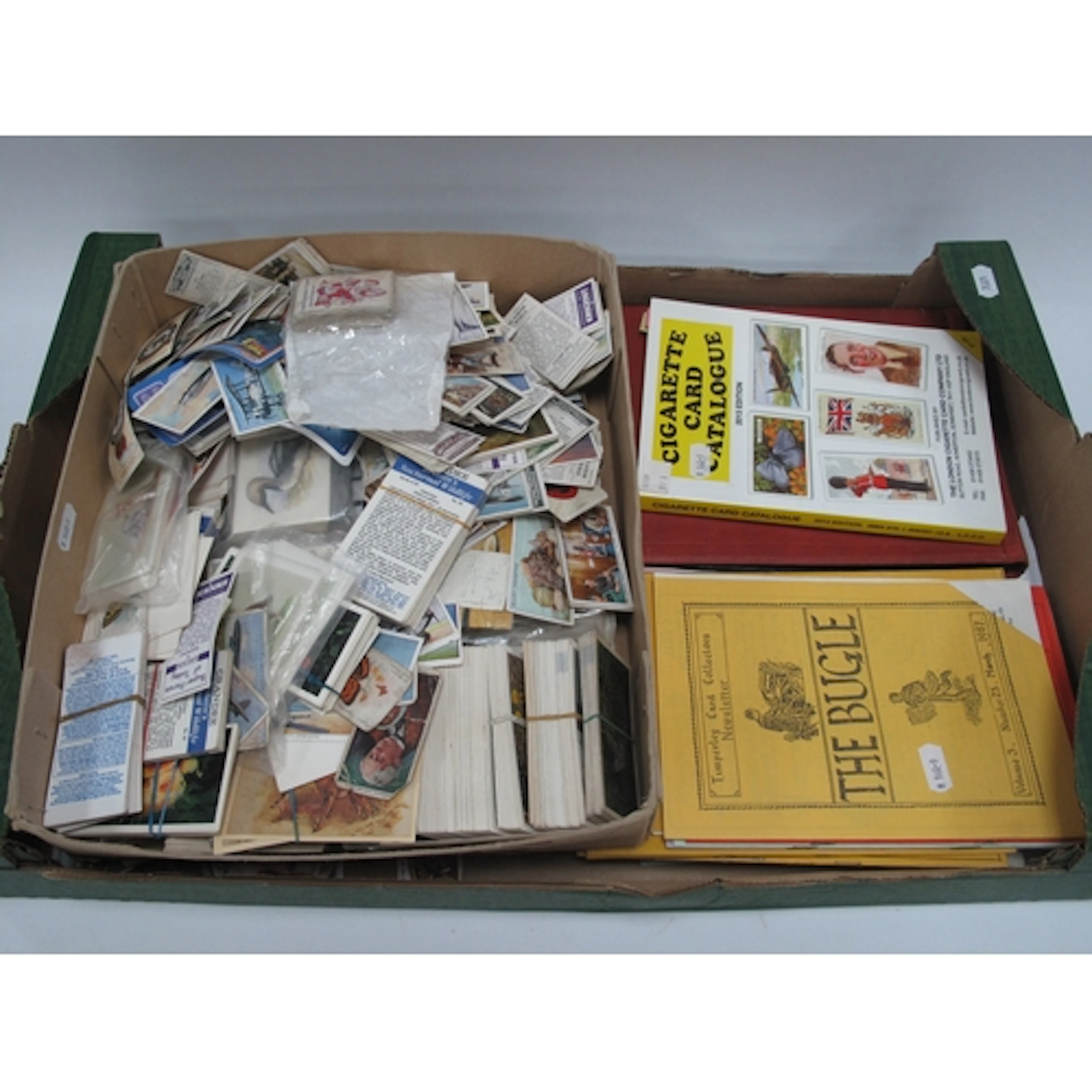 A collection of 20th-century cigarette cards, trade cards an...