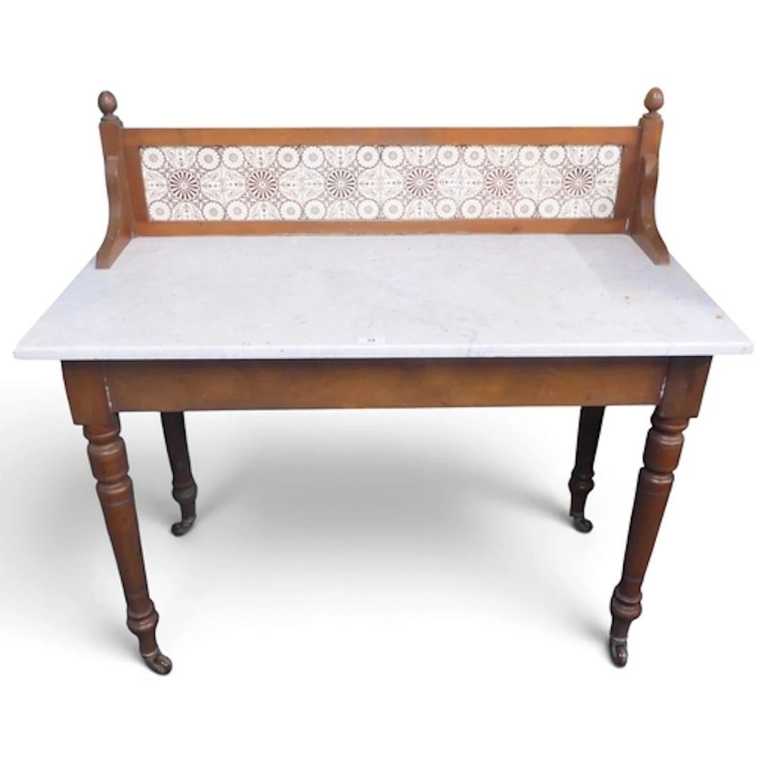 A 19th century tiled back marble top wash stand with stained...