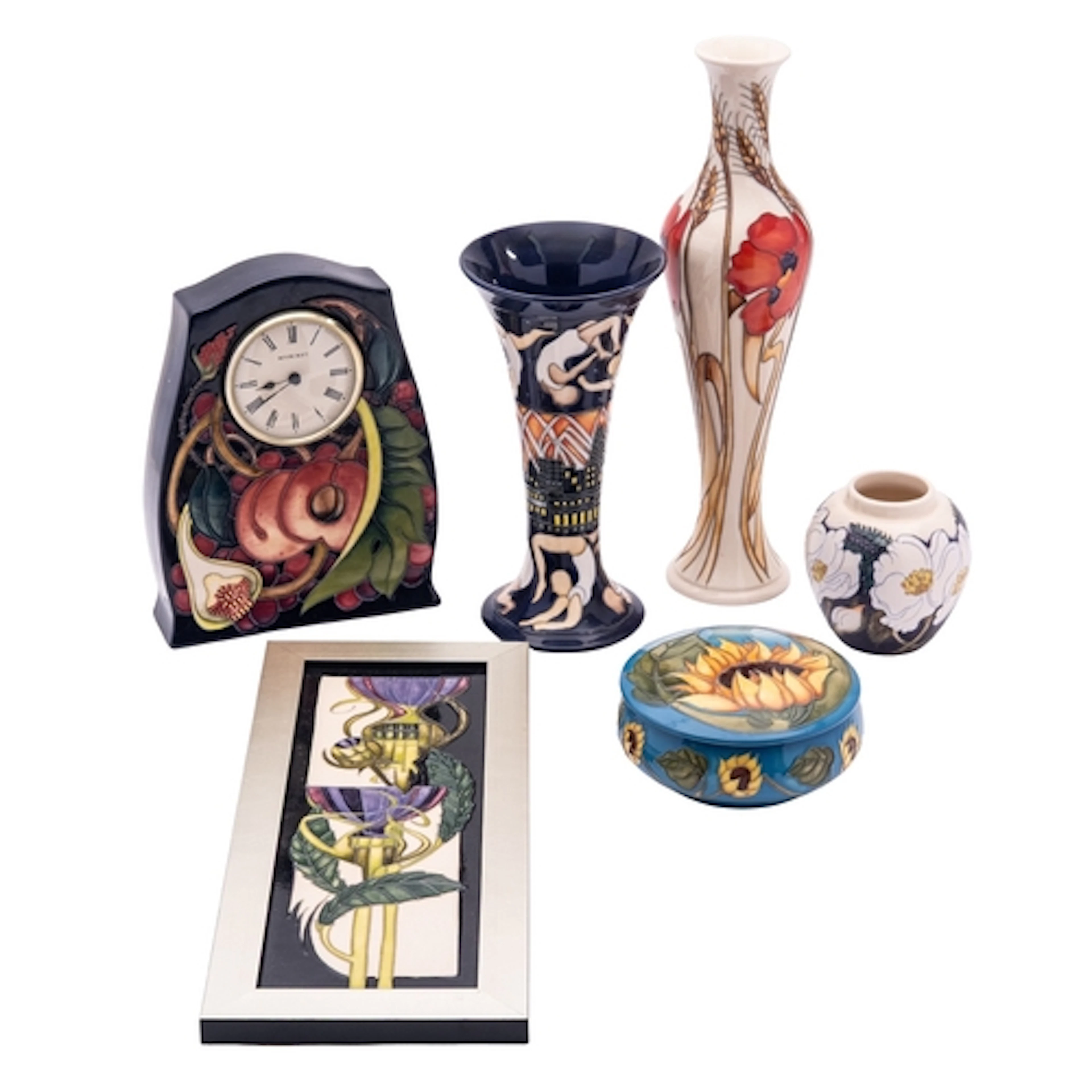 Six pieces of John Moorcroft pottery comprising a clock in t...