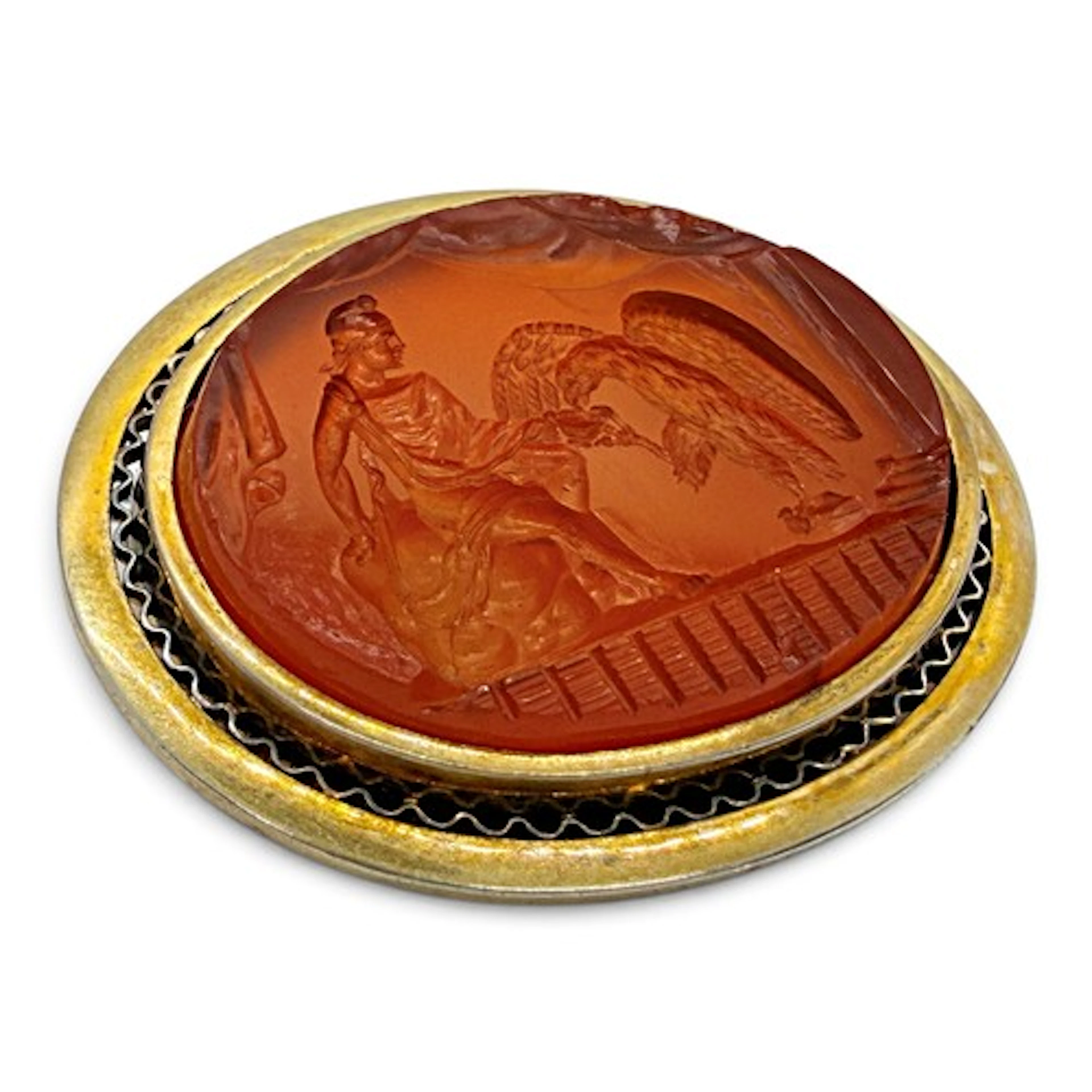 An impressive oval carnelian intaglio brooch depicting Ganym...