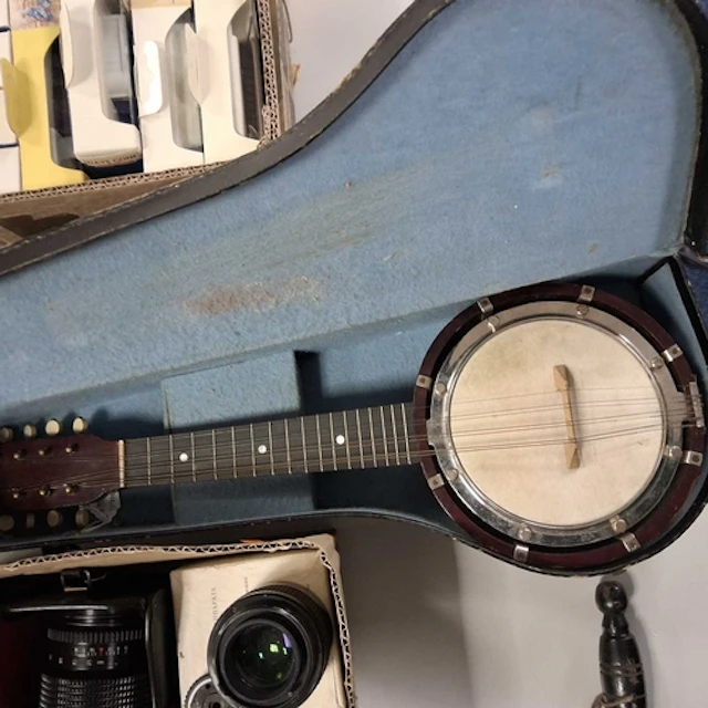 A CASED BANJO MANDOLIN stamped 'British Made' to the head, e...
