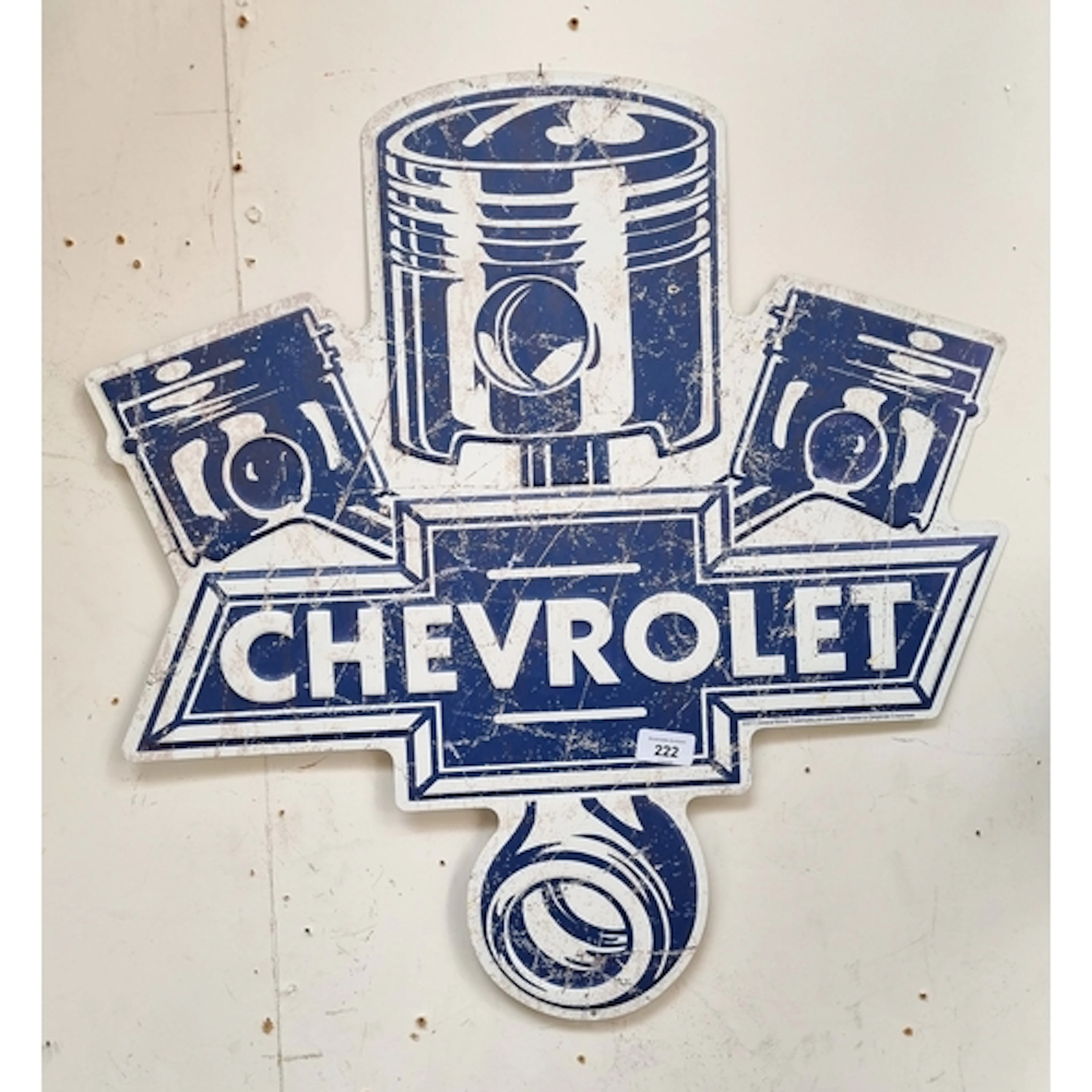 A blue and white Chevrolet advertising sign