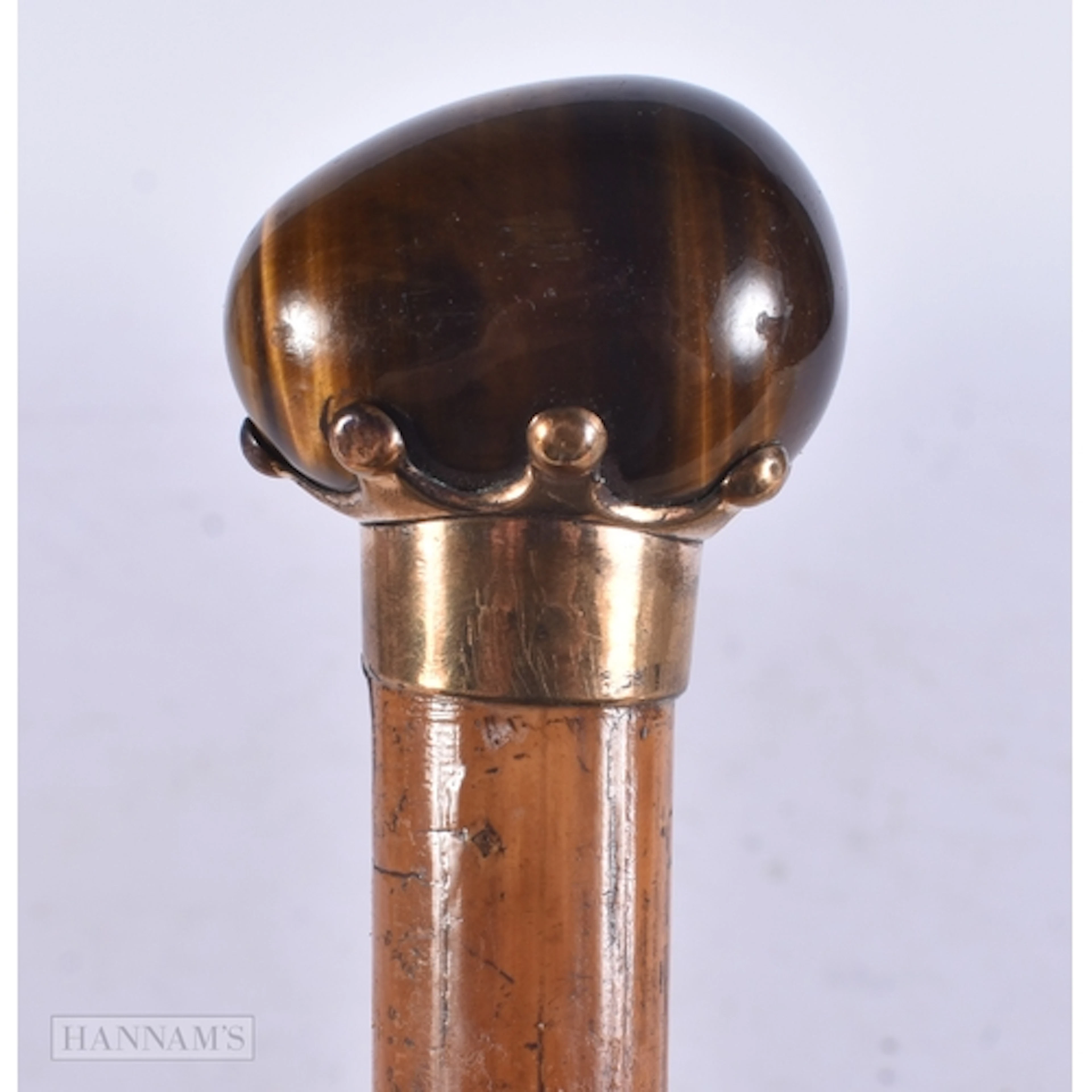 A VICTORIAN CARVED TIGERS EYE SWAGGER STICK CANE. 78 cm long...