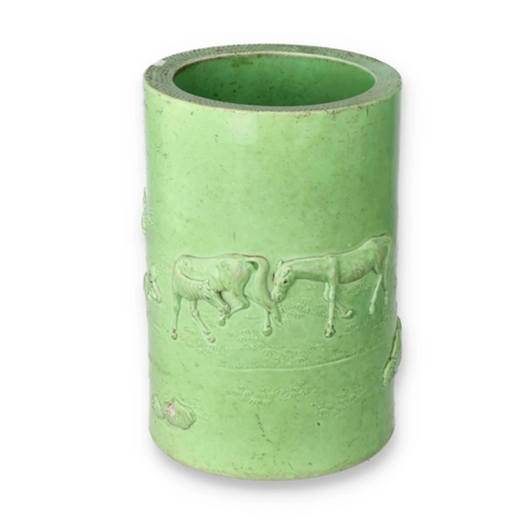 A CHINESE REPUBLIC PERIOD GREEN GLAZED RELIEF CARVED BRUSH P...
