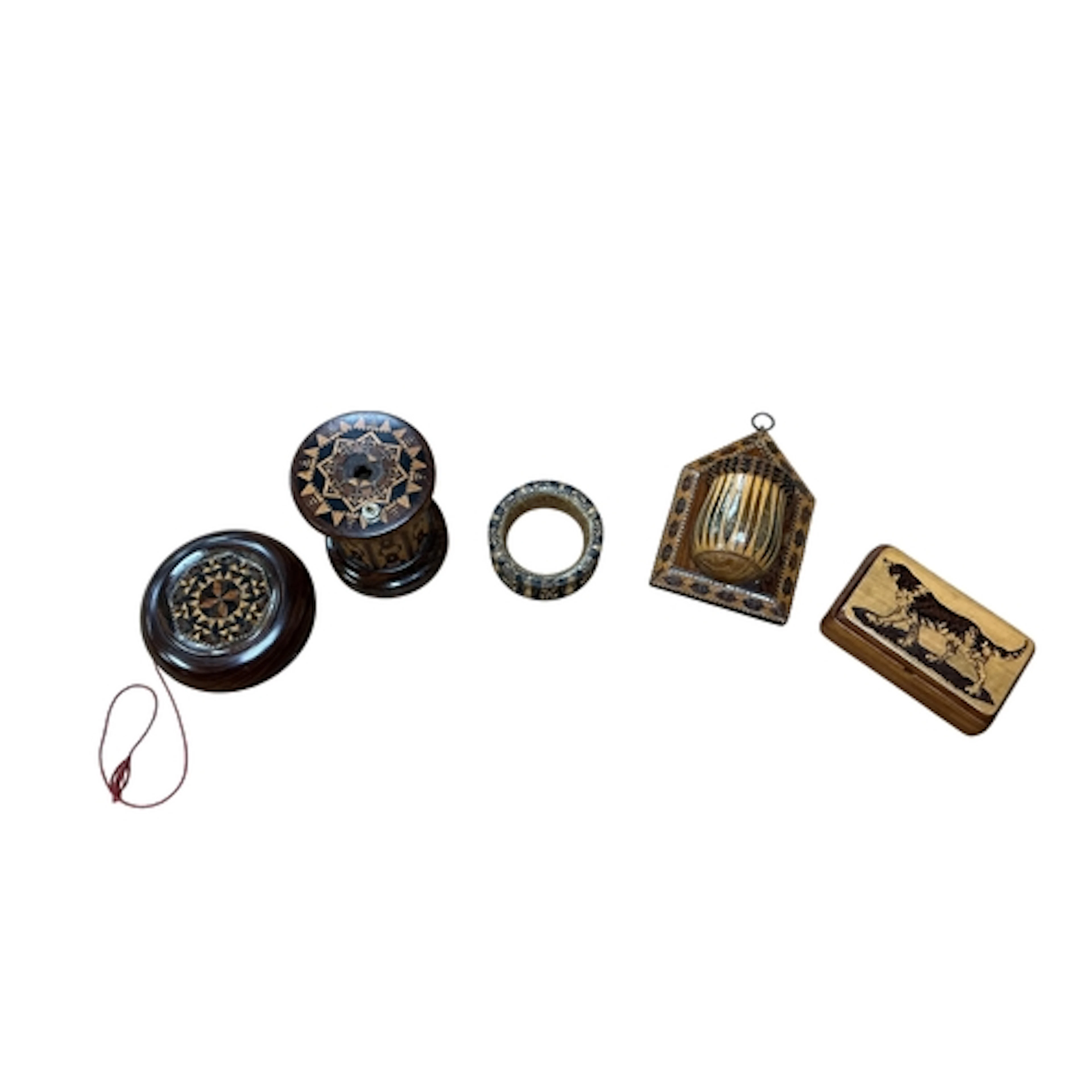 Five pieces of Tunbridge ware comprising a spaniel decorated...