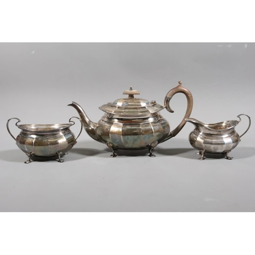 Three piece teaset, retailed b Hamilton & Inches, of cla...