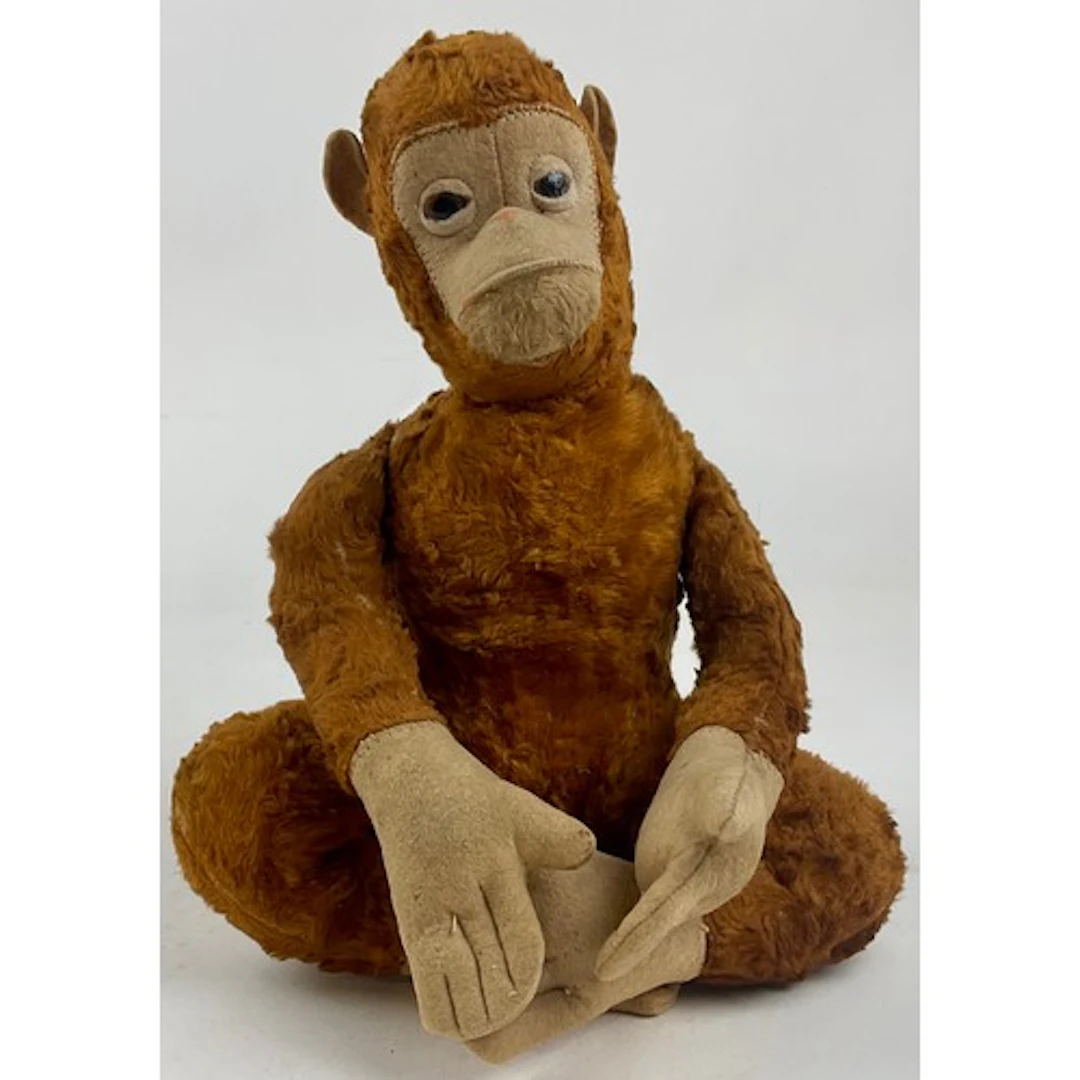 A mid 20th century novelty light brown mohair Monkey, cream ...