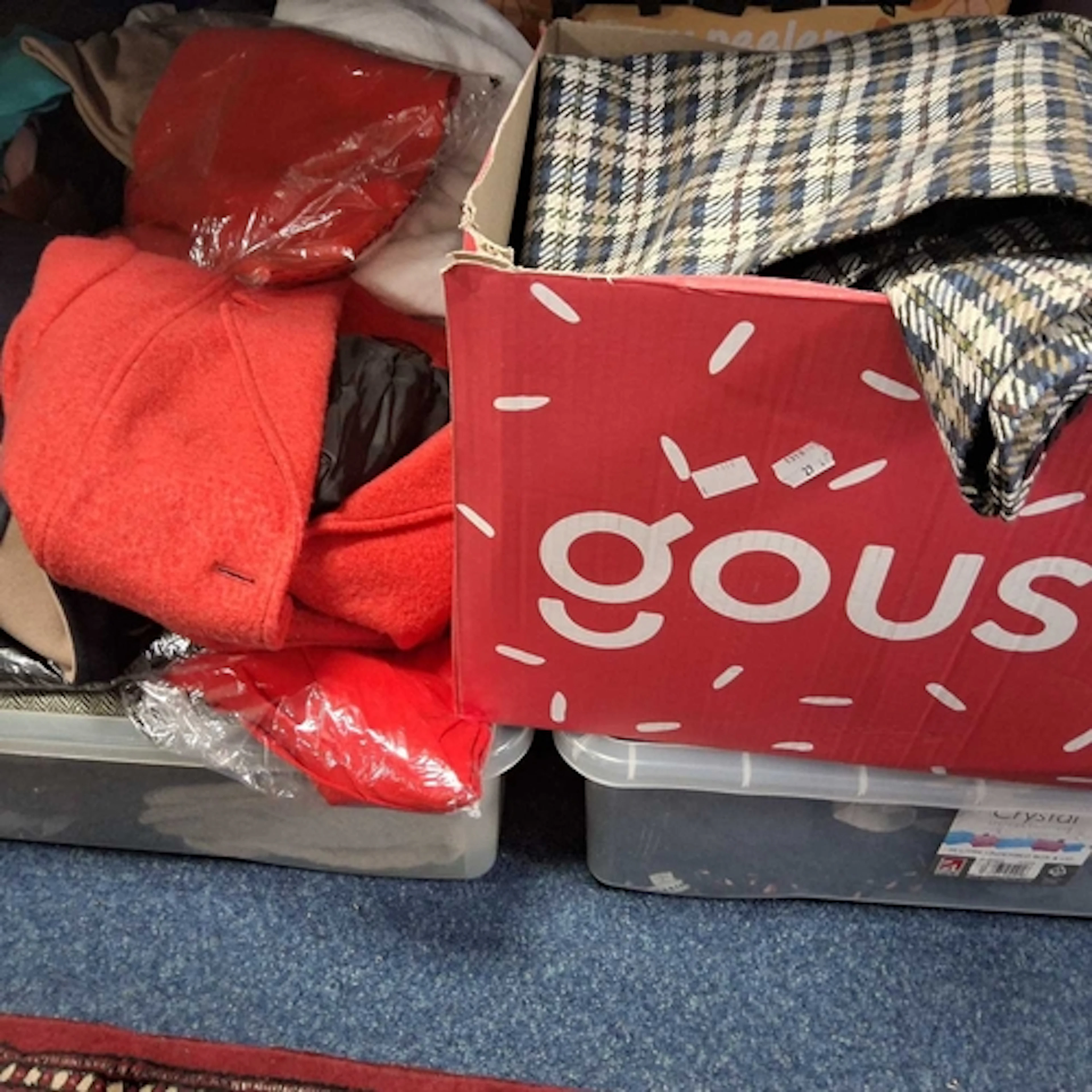 SIX BOXES OF CLOTHES to include an assortment of various top...