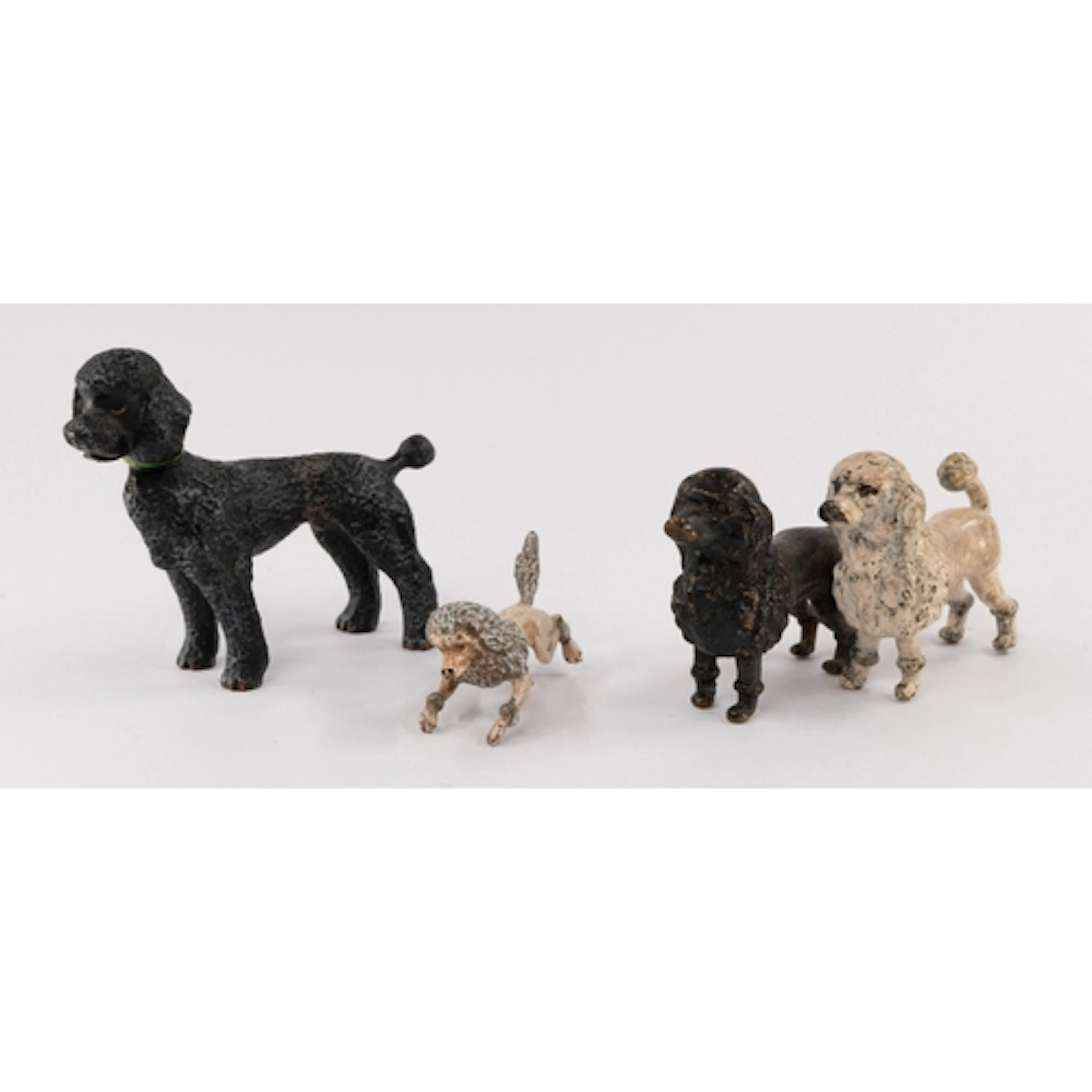 A cold-painted bronze group of two poodles, late 19th/20th c...