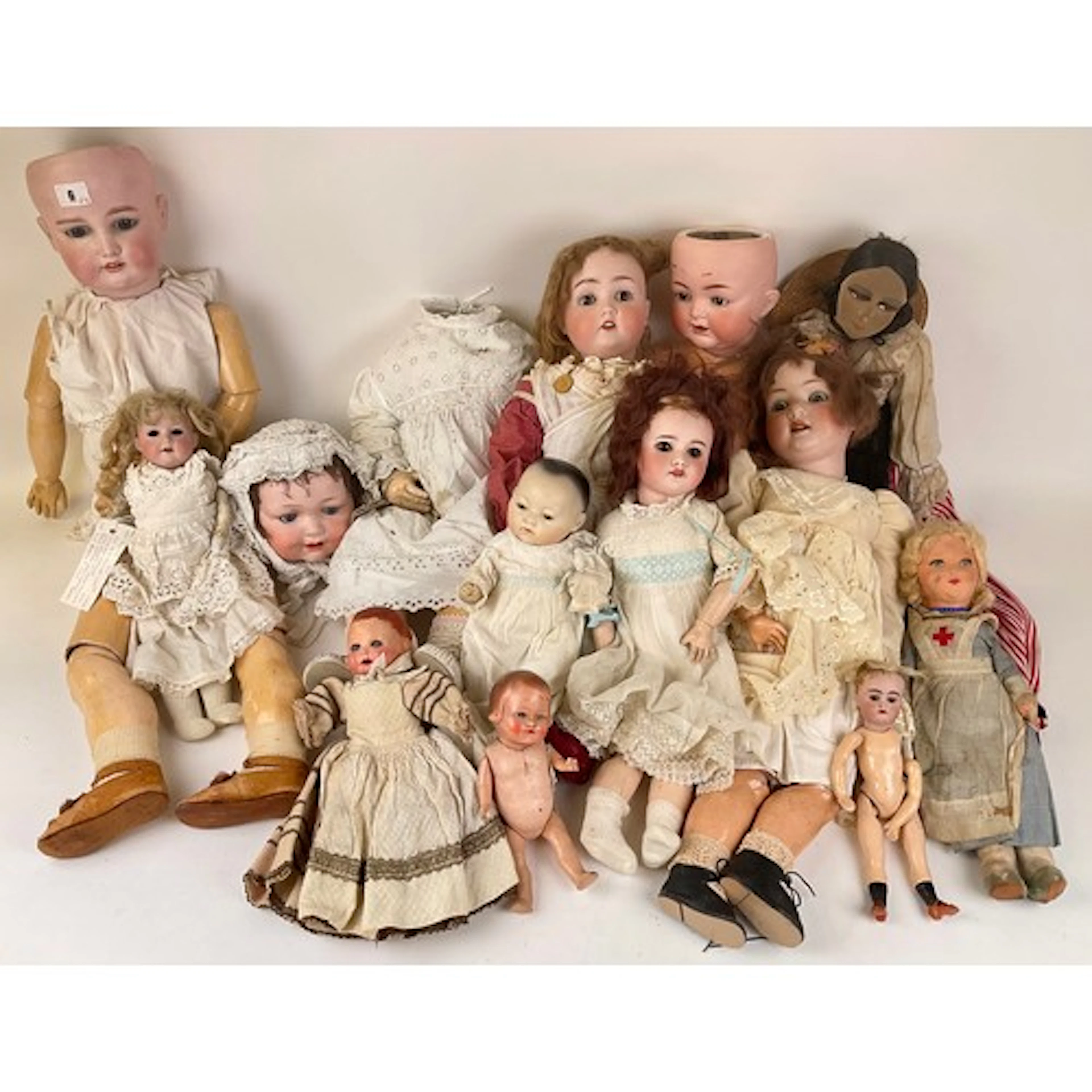 Dolls - A 19th century German composite doll with fabric bod...
