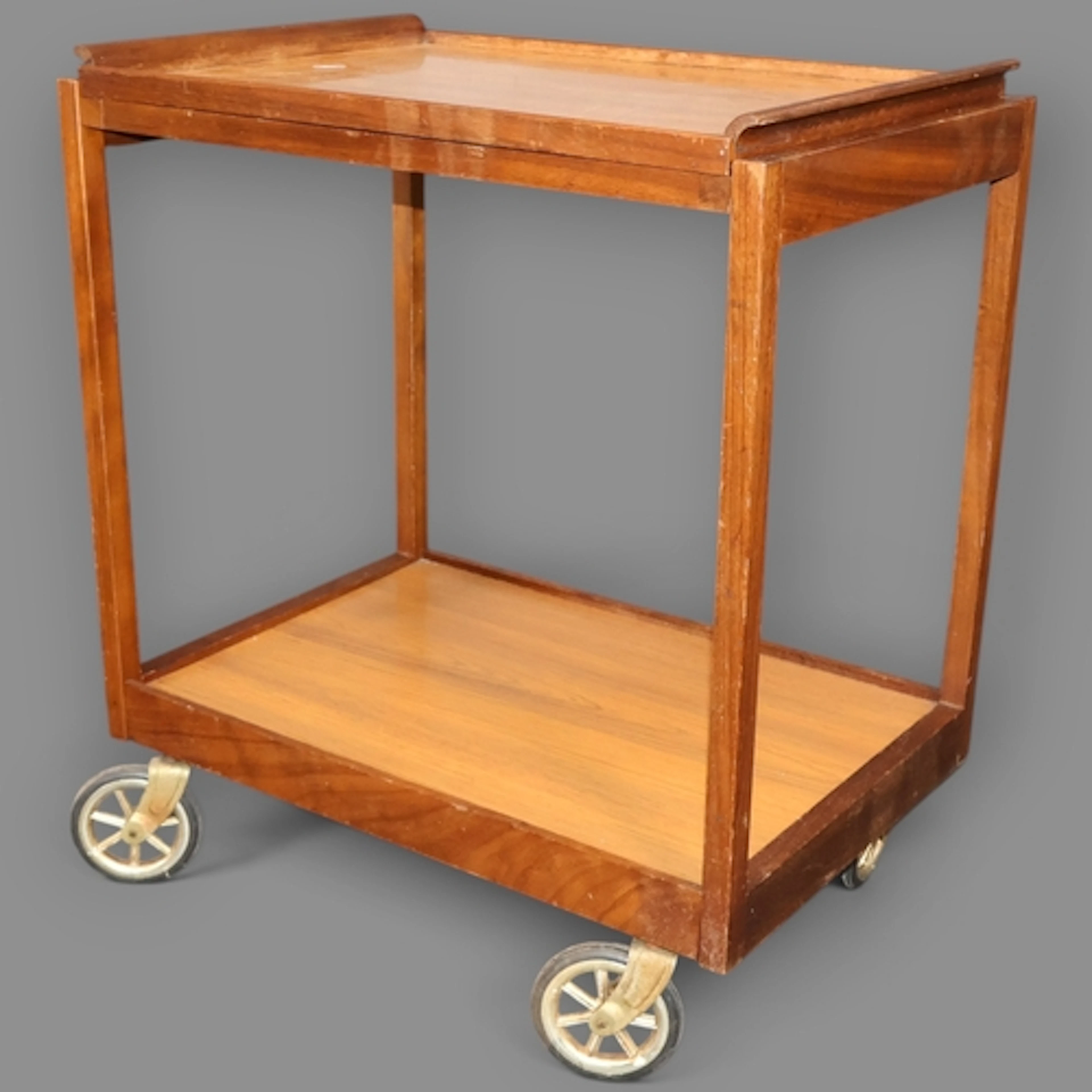 A Vintage Scandinavian teak and afromosia two tier drinks tr...