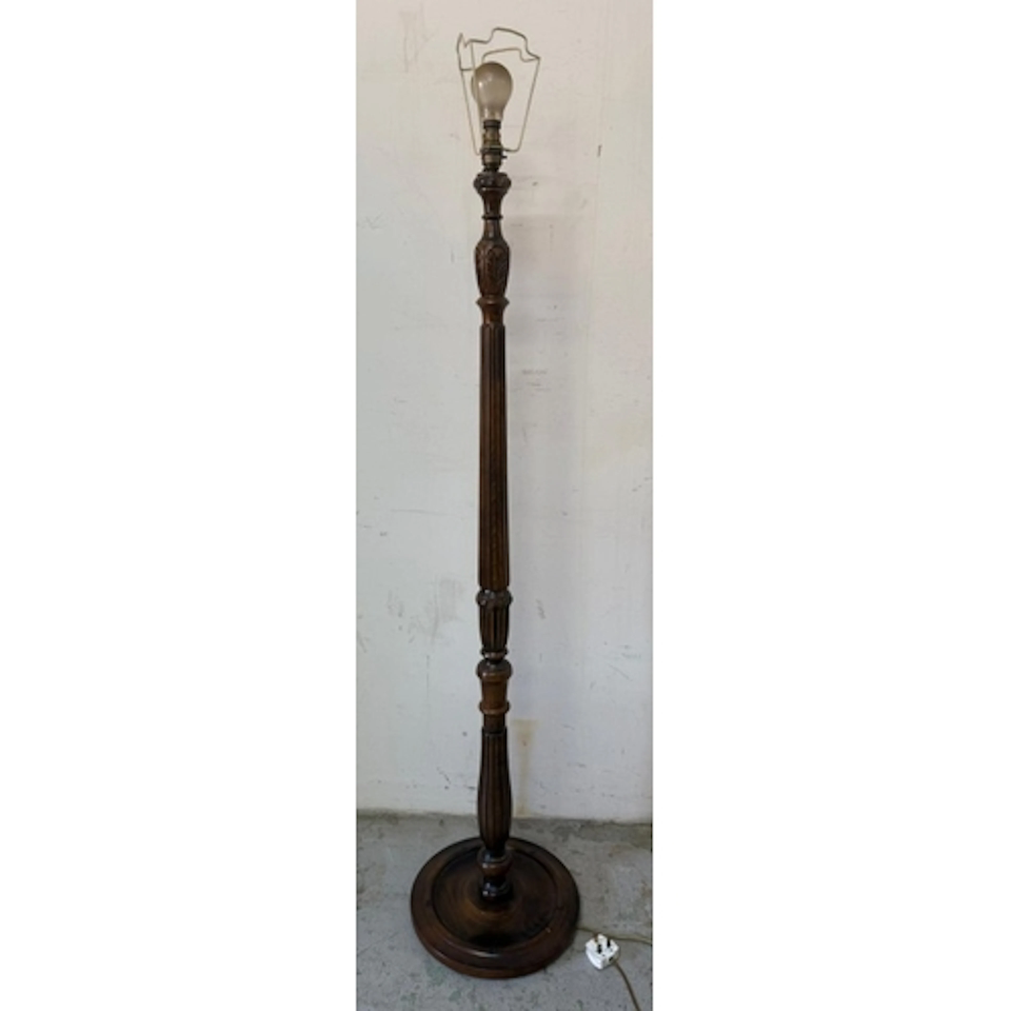An Old Charm standard lamp with a fluted central column...