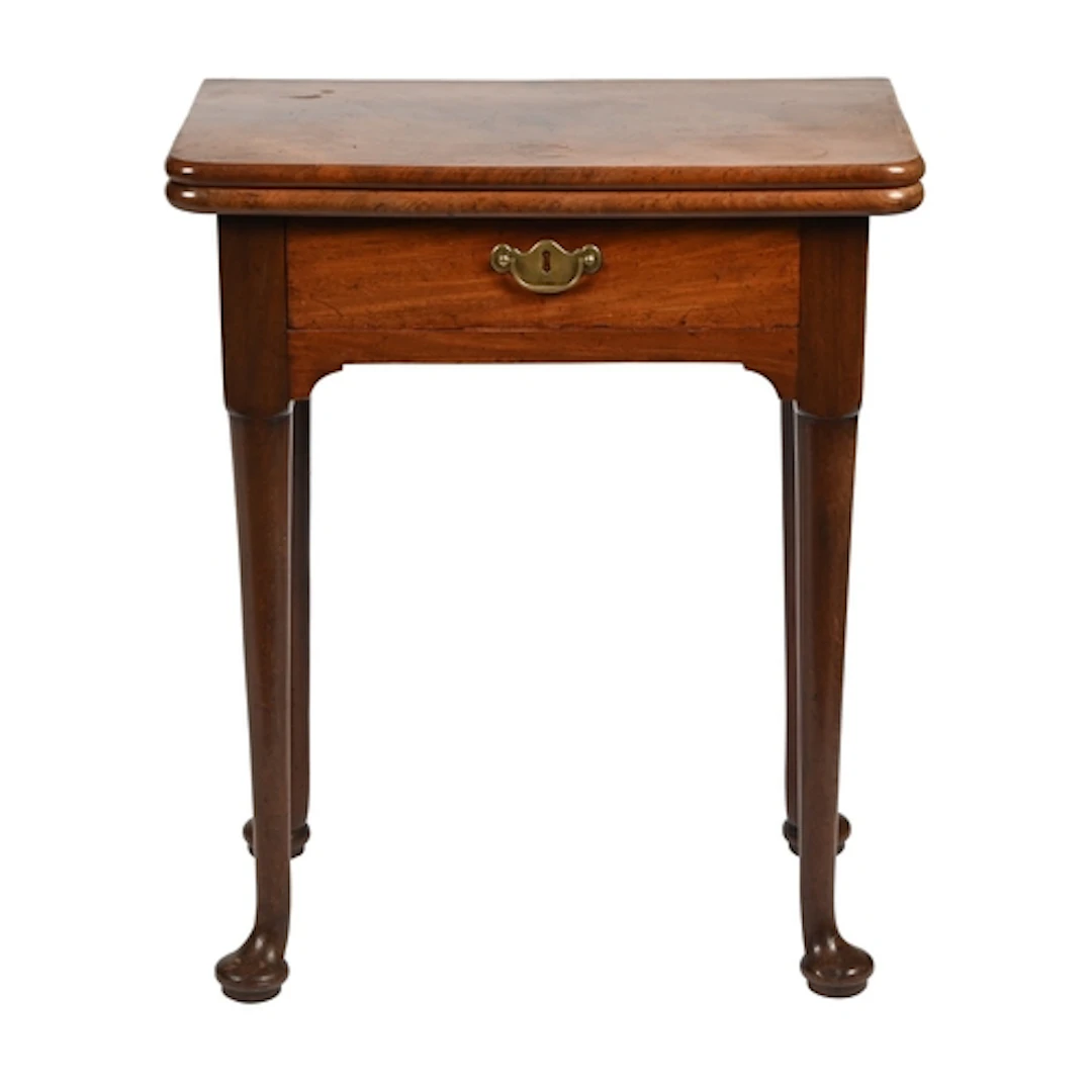 A George II mahogany tea table, the rounded rectangular top ...