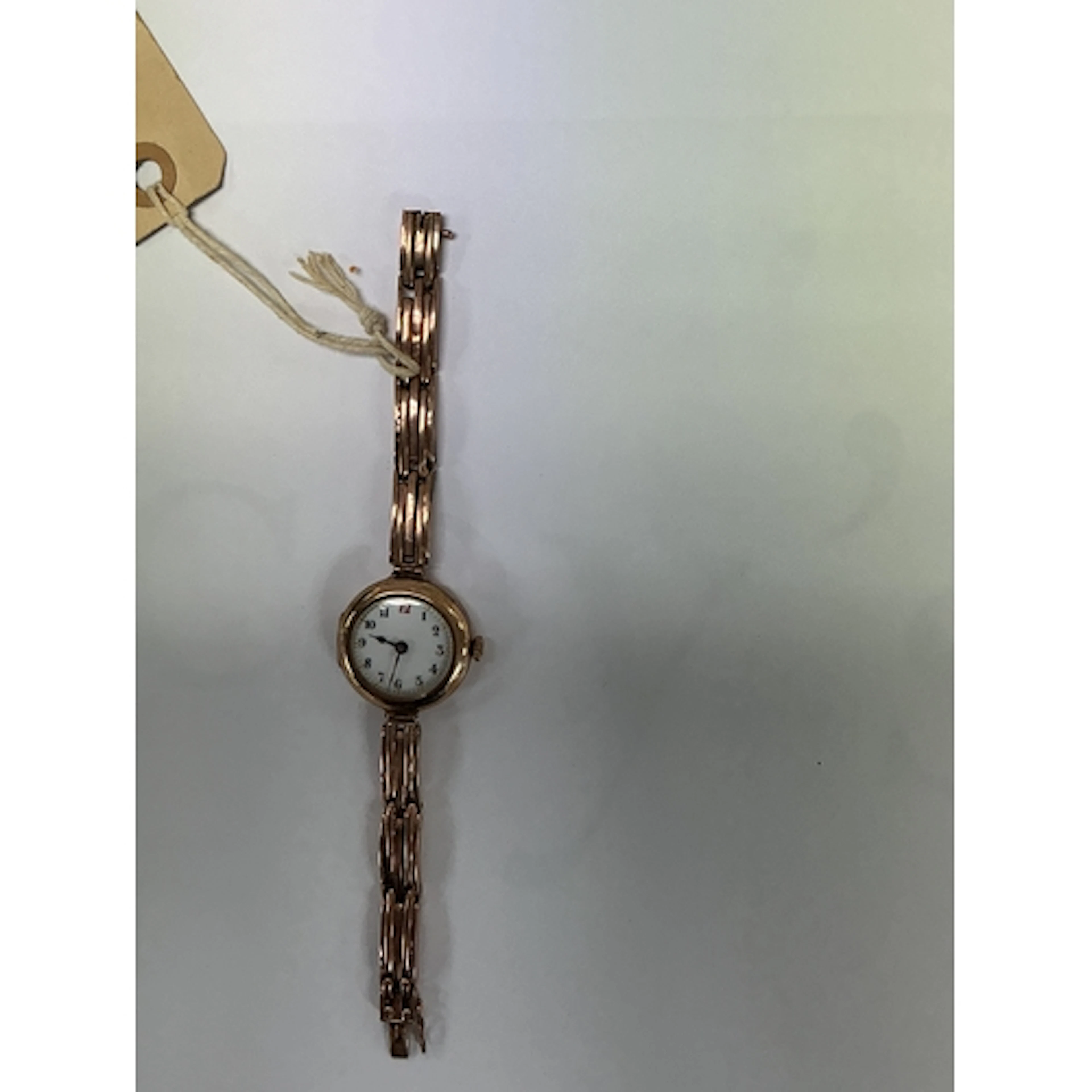 A vintage 9ct gold ladies wristwatch on articulated gold str...
