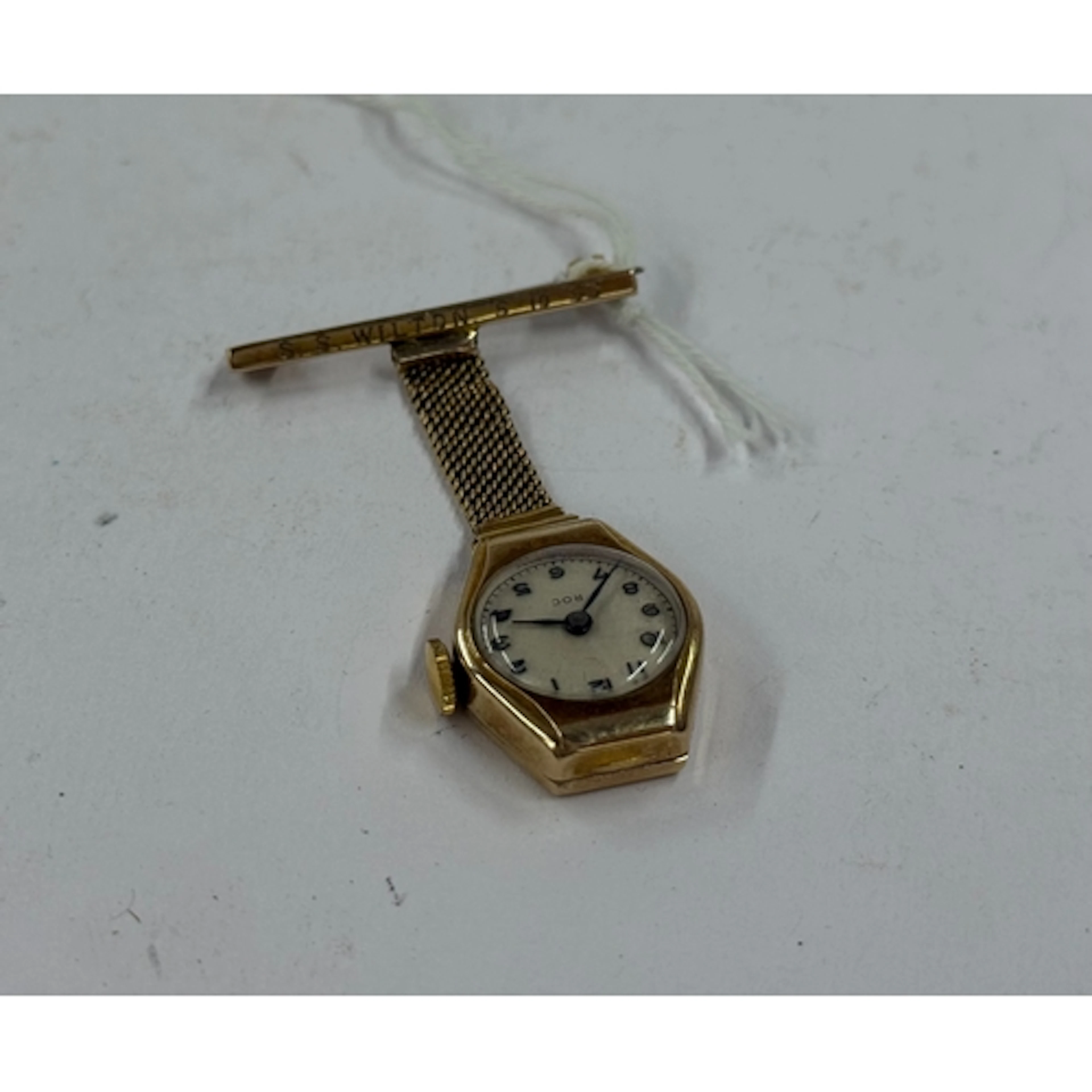Watches: a ladies 9ct gold cased pendant brooch watch by Roc...