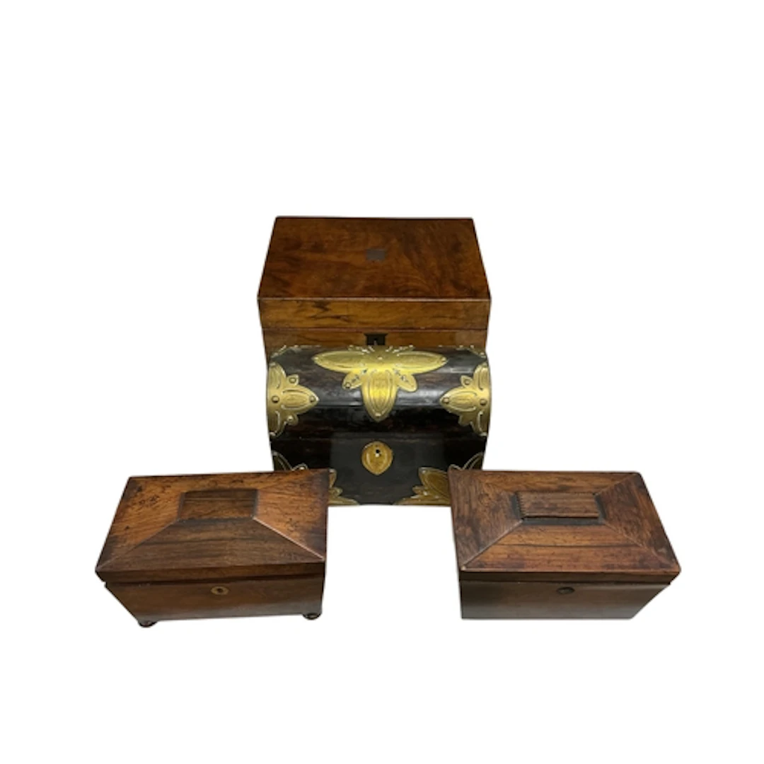 A Victorian coromandel domed box with brass strapwork, a wri...