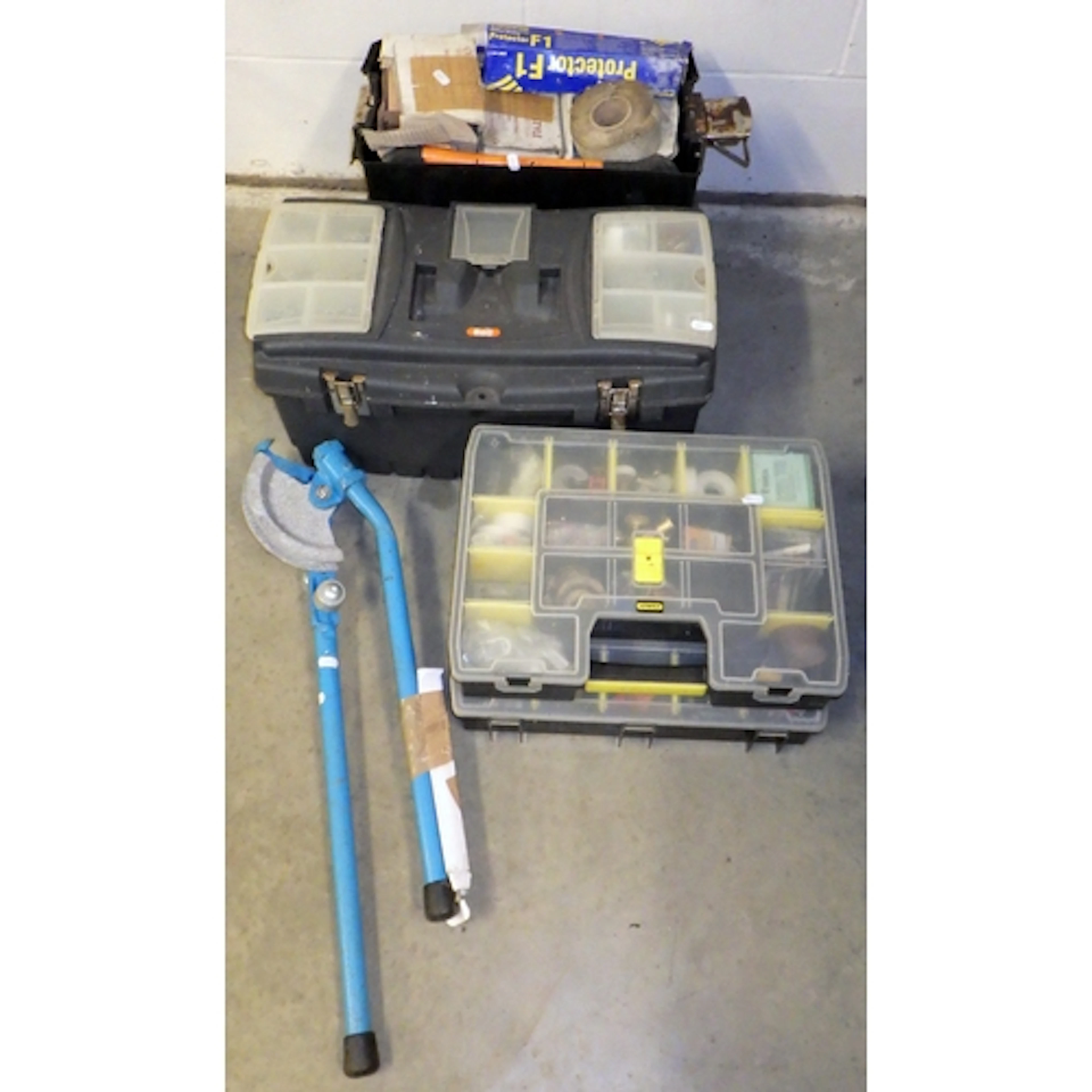 A pipe bender, toolbox, tiles etc