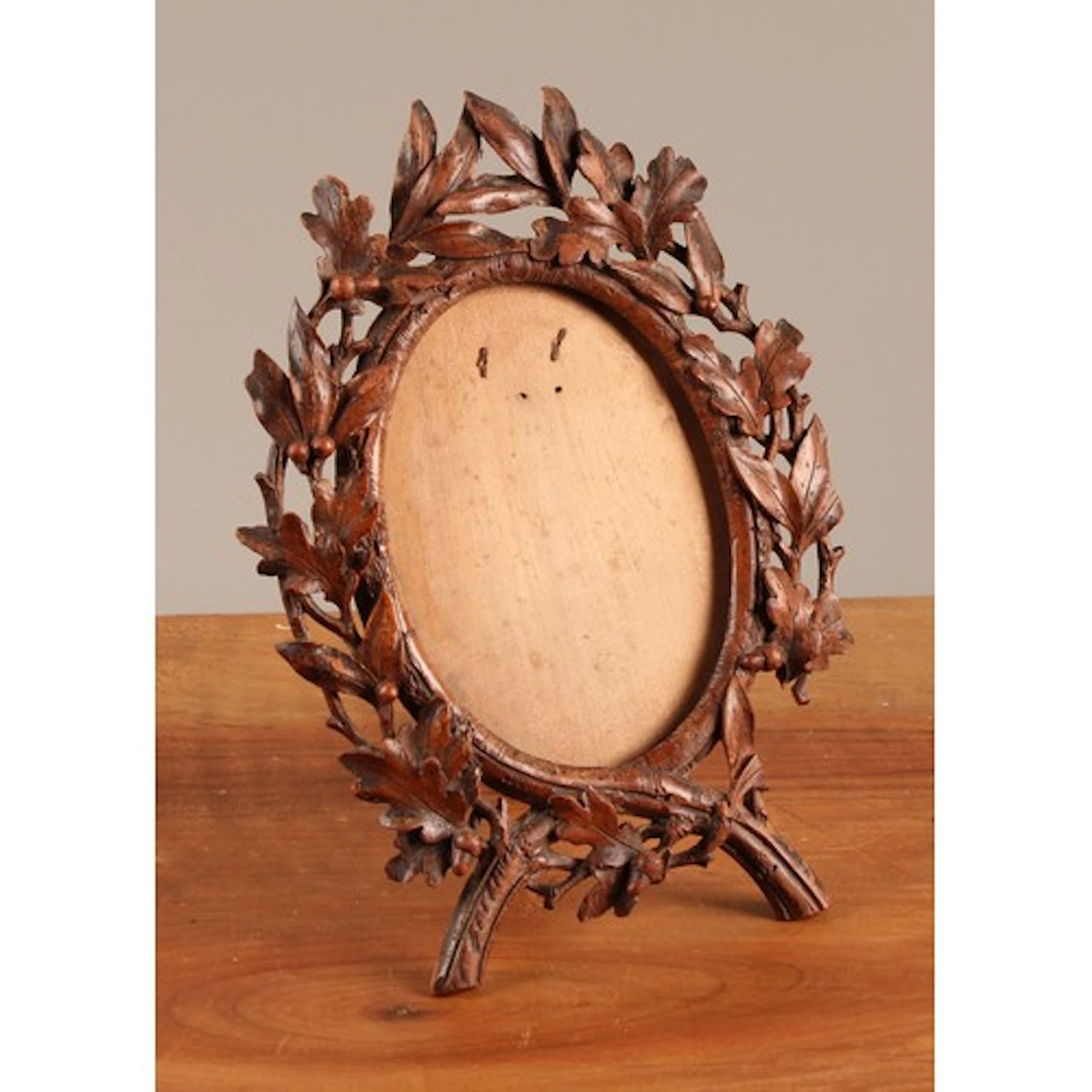 A 19th century Black Forest linden wood easel picture or pho...