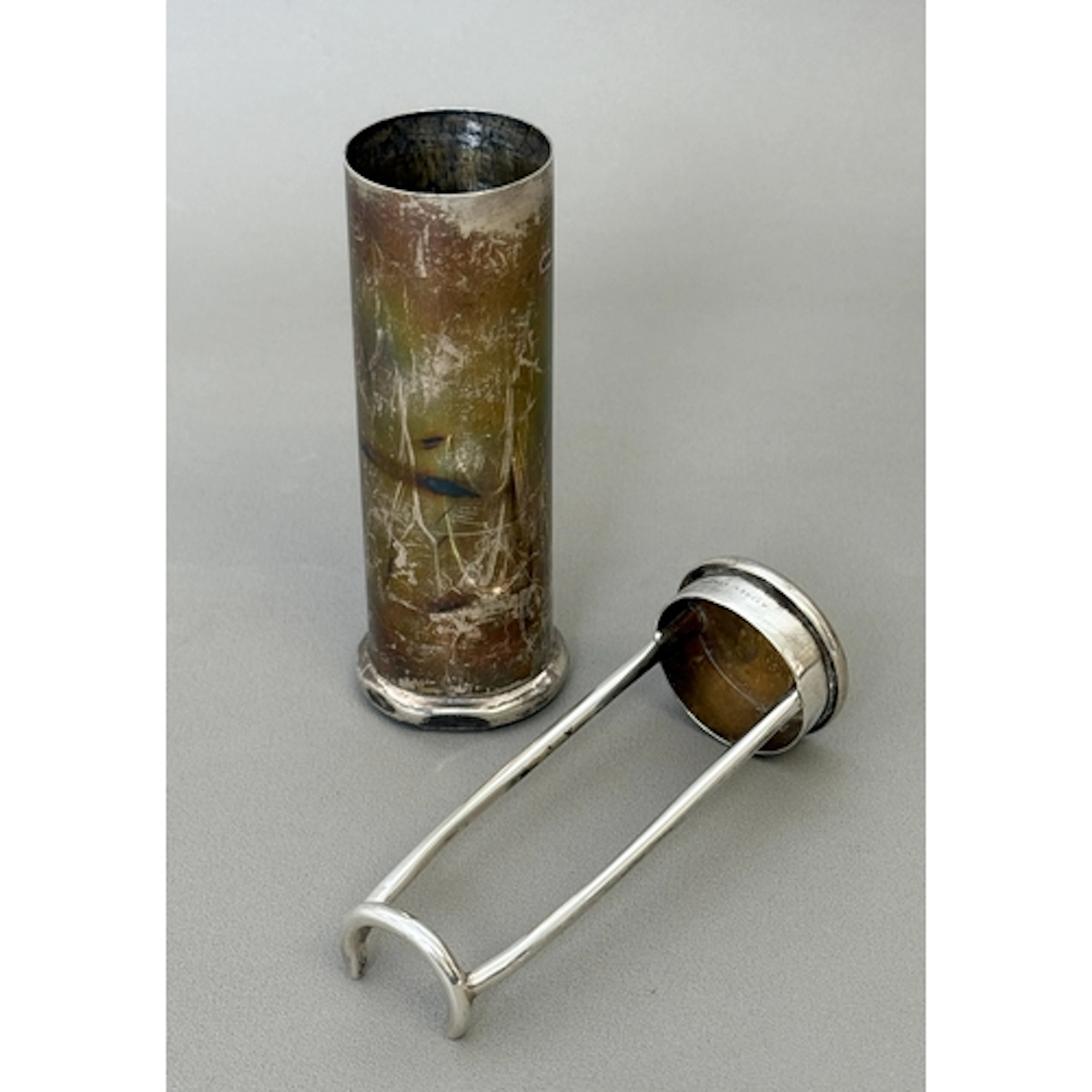An Asprey silver travel case and stand of cylindrical form, ...