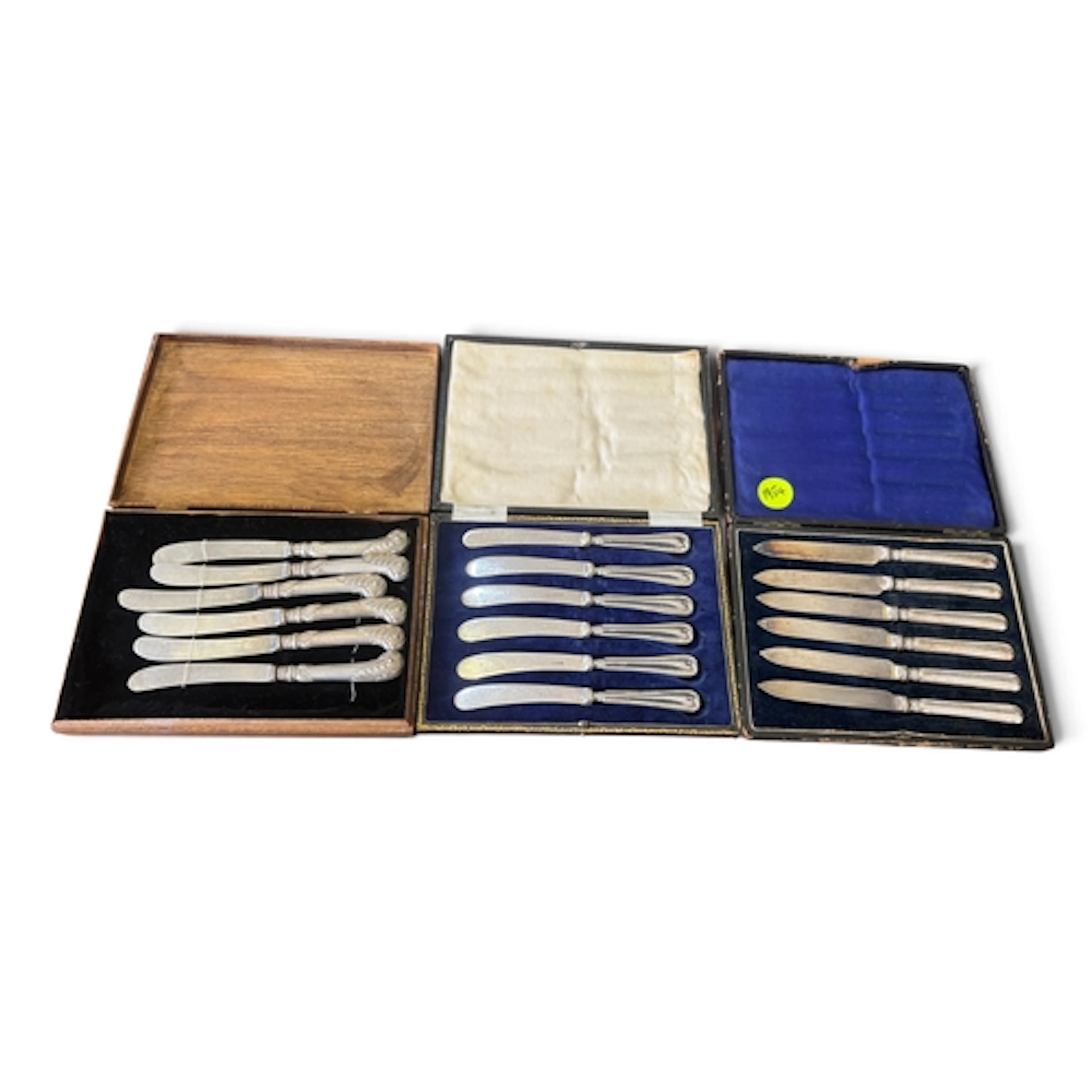 THREE BOXED SETS OF KNIVES One with silver handles....