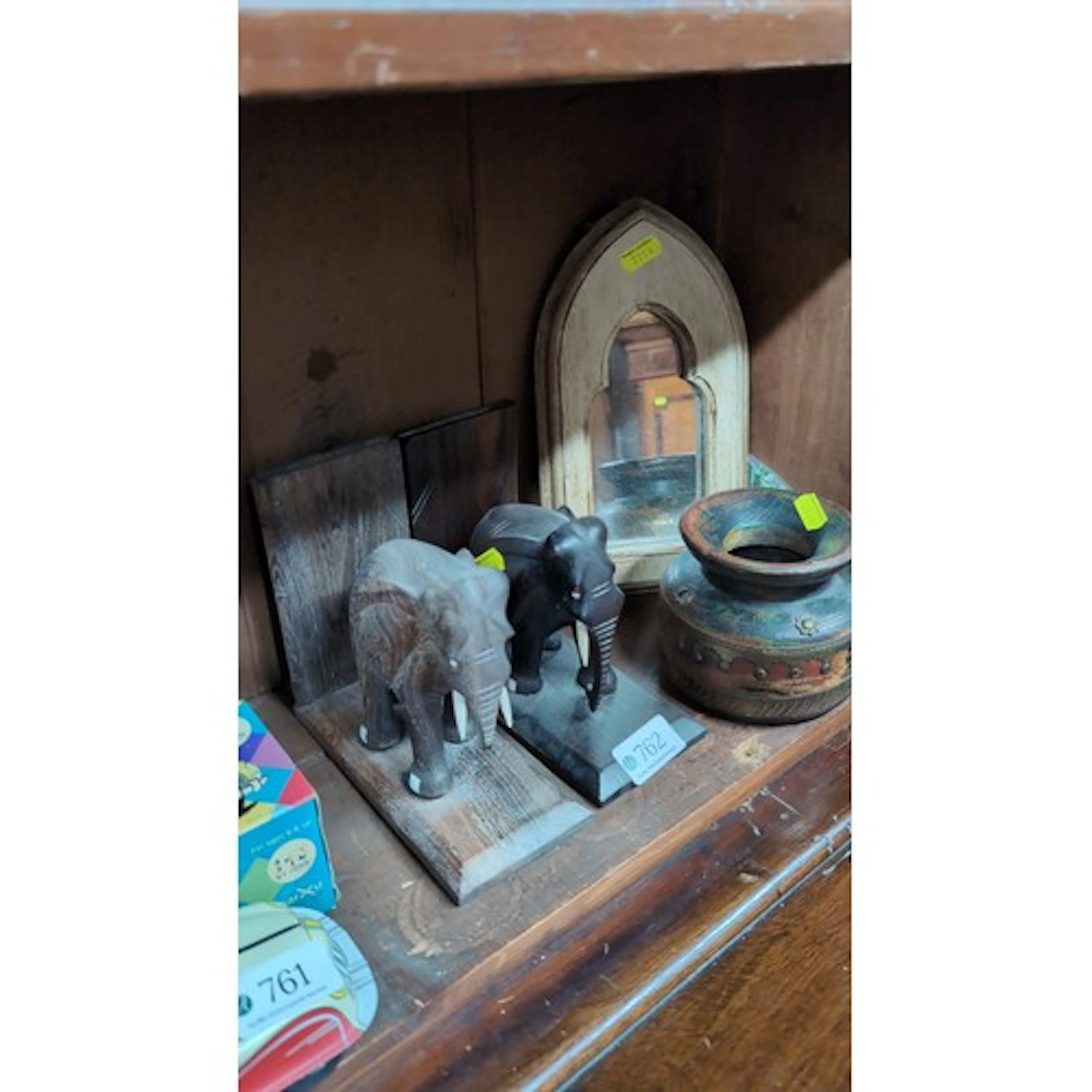 A small group of decorative objects including two carved and...
