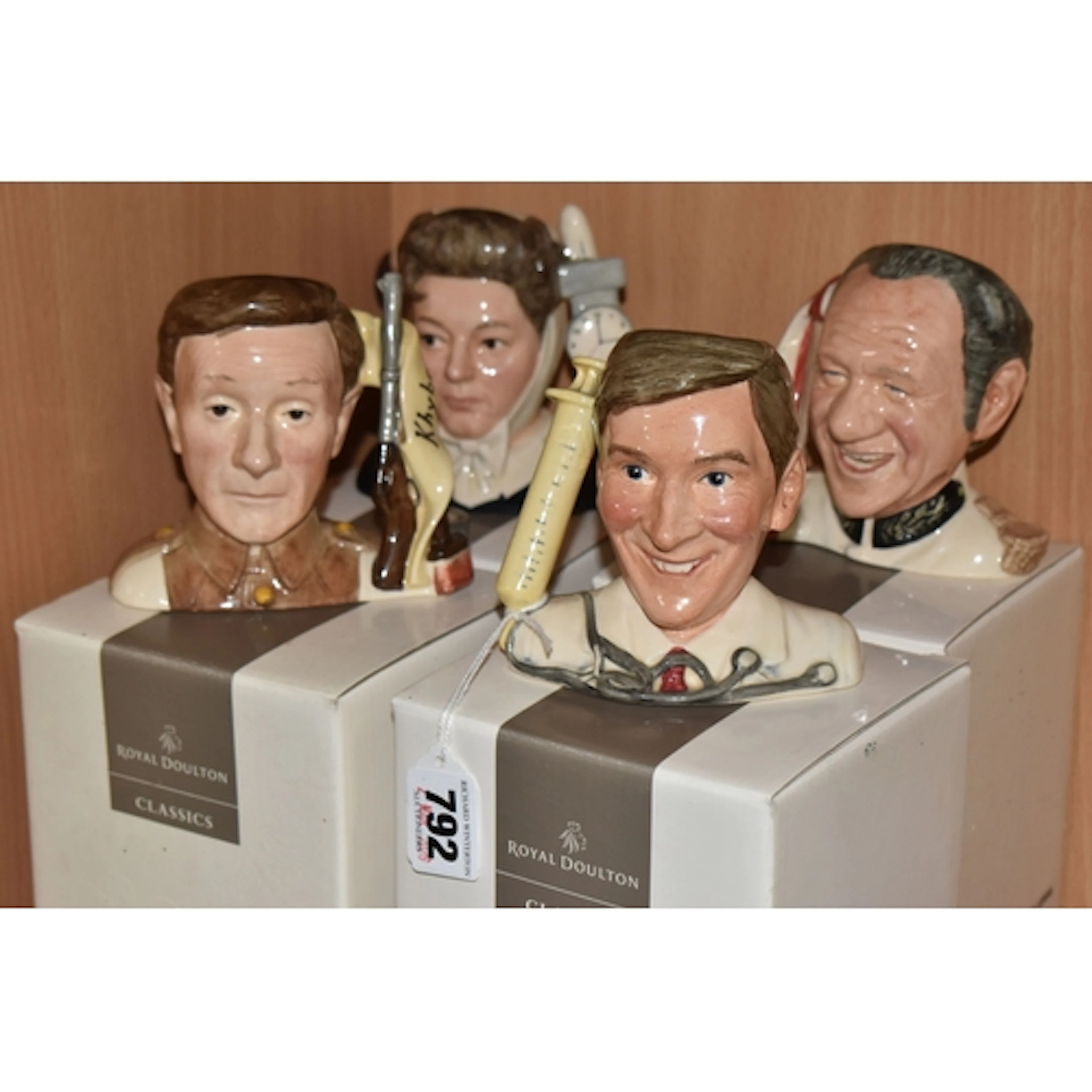 A GROUP OF FOUR BOXED ROYAL DOULTON 'CARRY ON' CHARCTAER JUG...