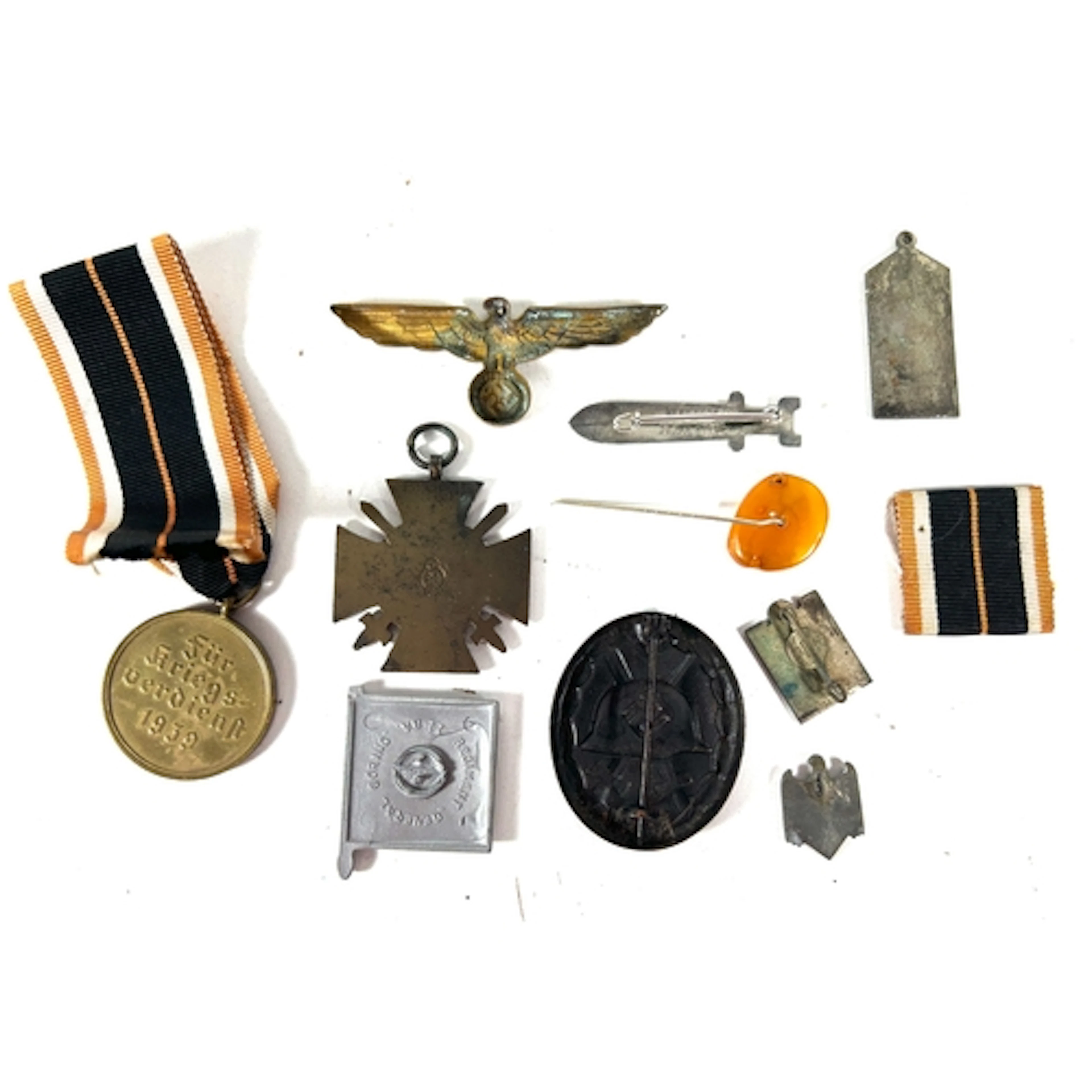 Assortment of German badges and medals. WW1 Hindenburg cros...