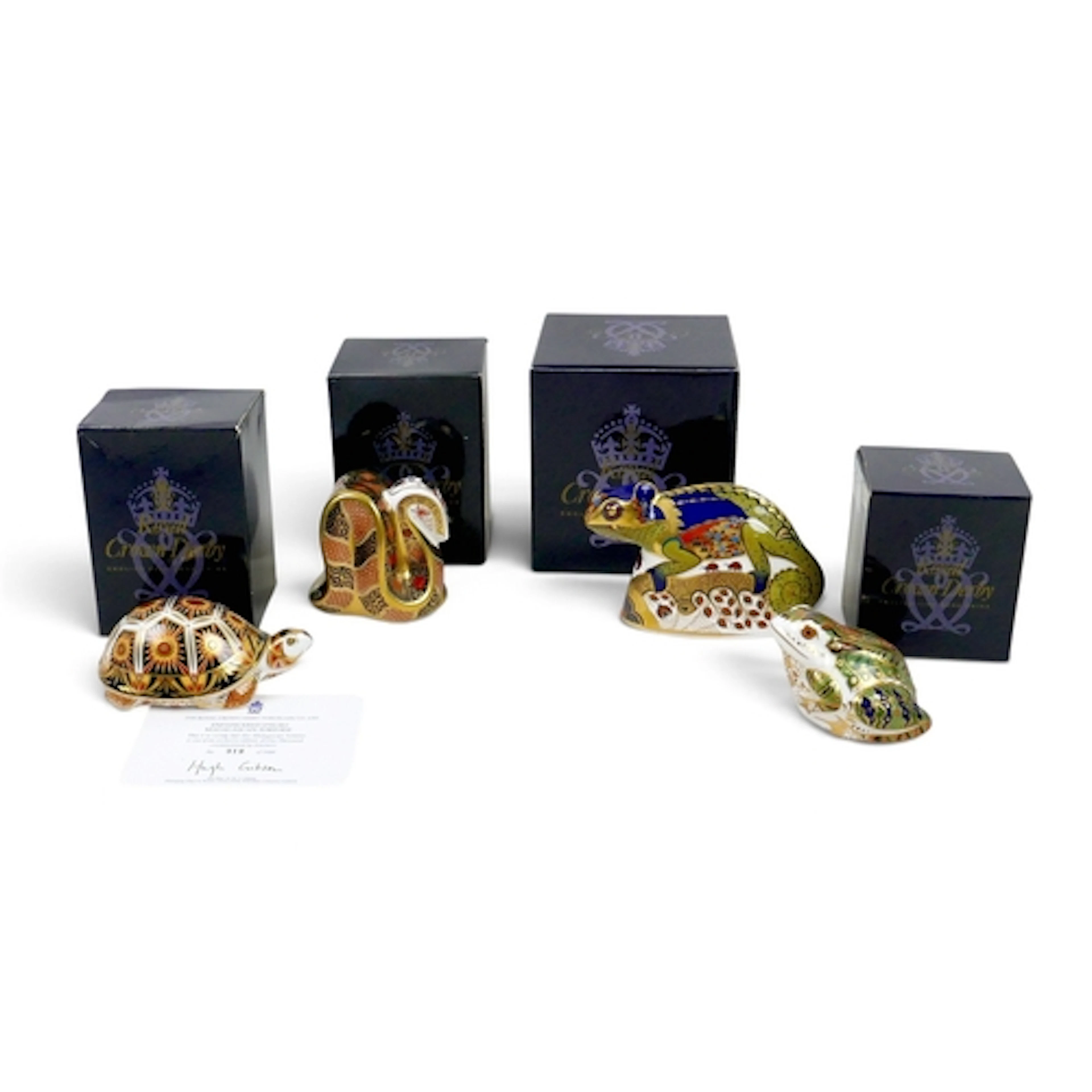 FOUR ROYAL CROWN DERBY PAPERWEIGHTS. comprising a limited ed...