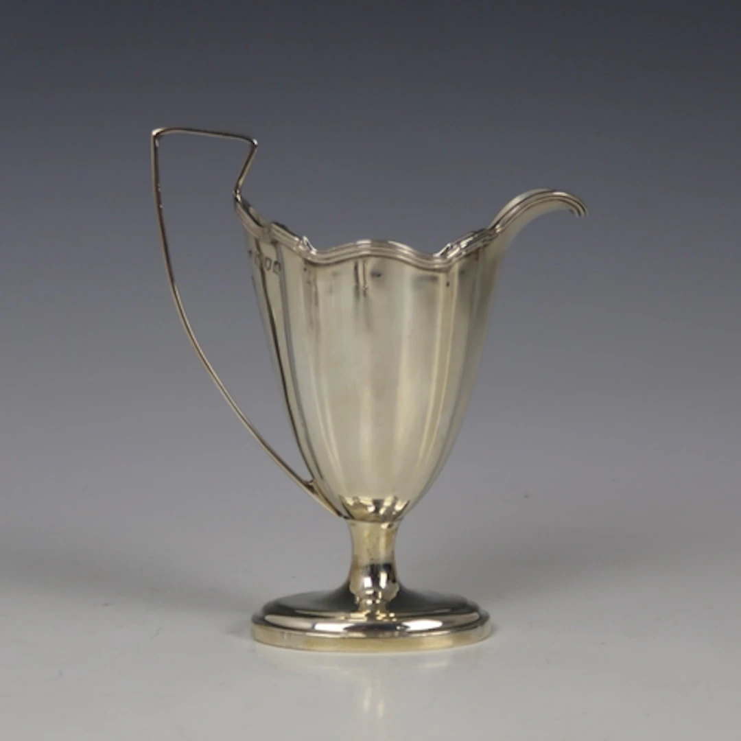 A Victorian silver cream jug, Thomas Bradbury & Sons, London...