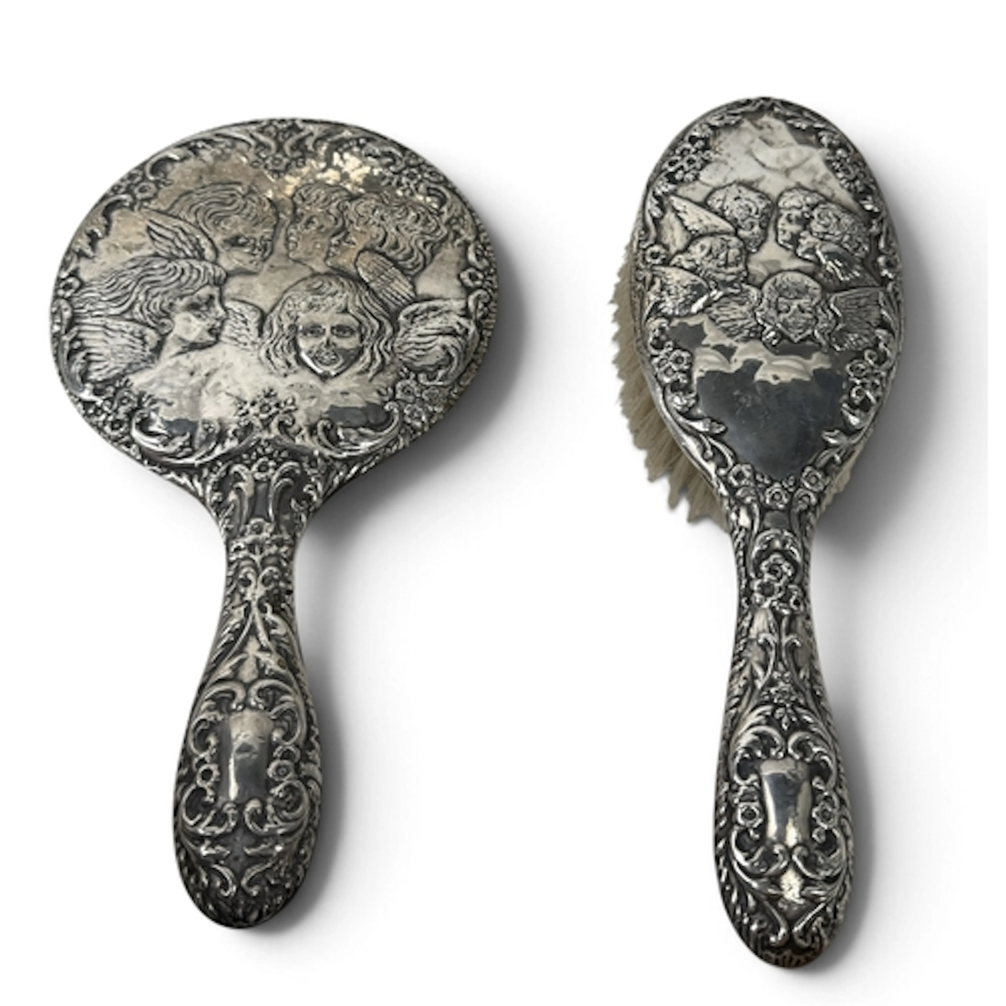 A SILVER HAND MIRROR AND HAIR BRUSH, DECORATED WITH JOSHUA R...
