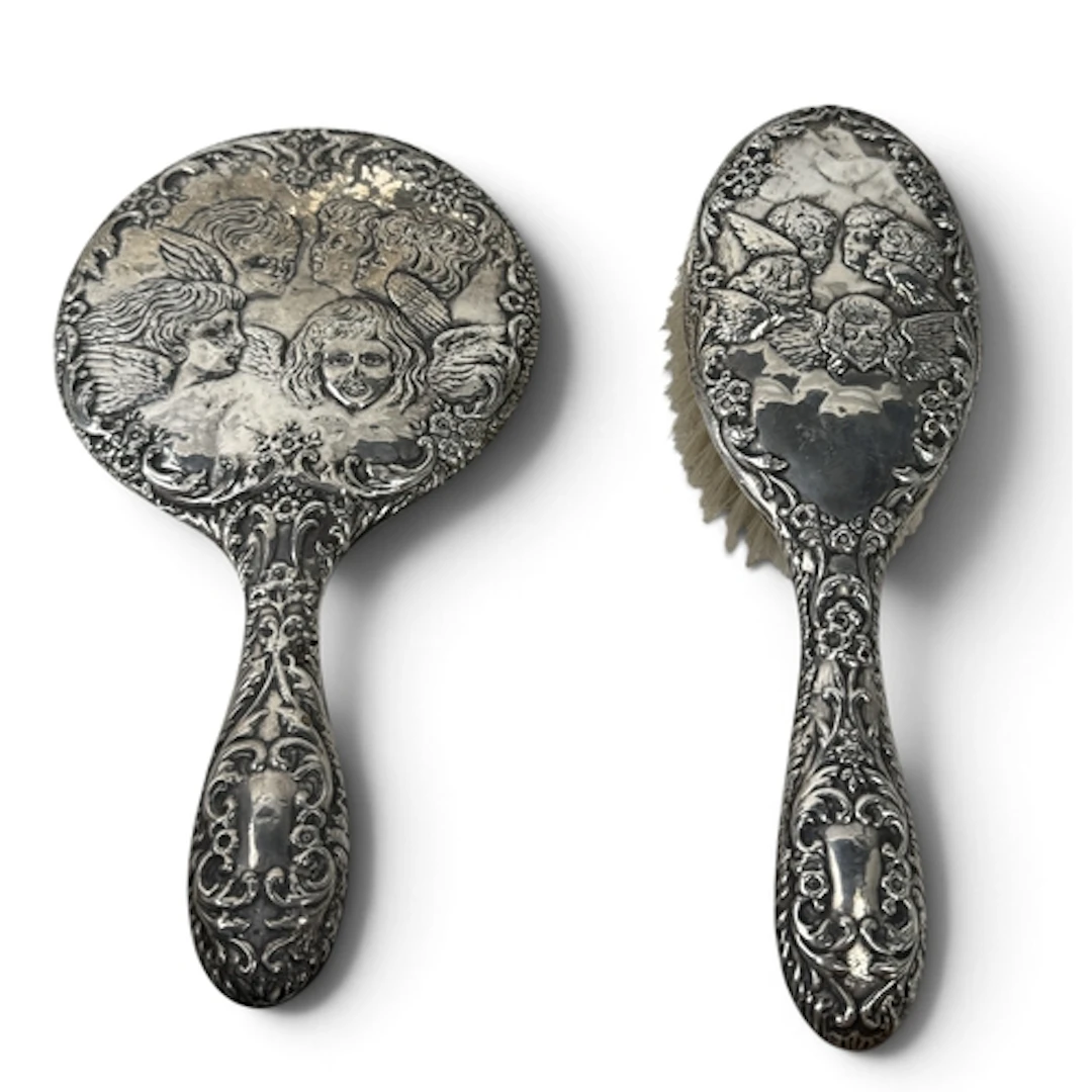 A SILVER HAND MIRROR AND HAIR BRUSH, DECORATED WITH JOSHUA R...