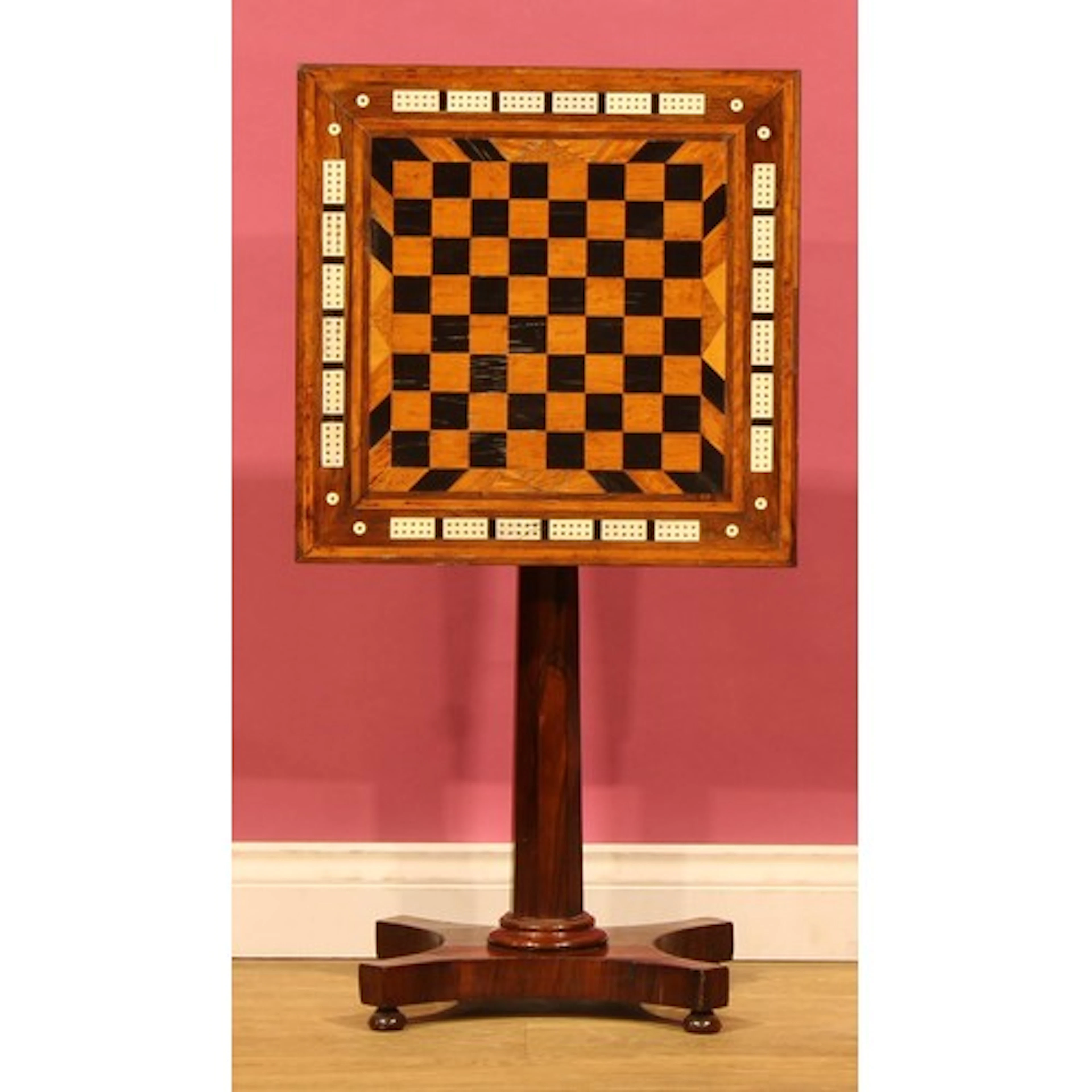 A William IV rosewood pedestal games table, square tilting t...