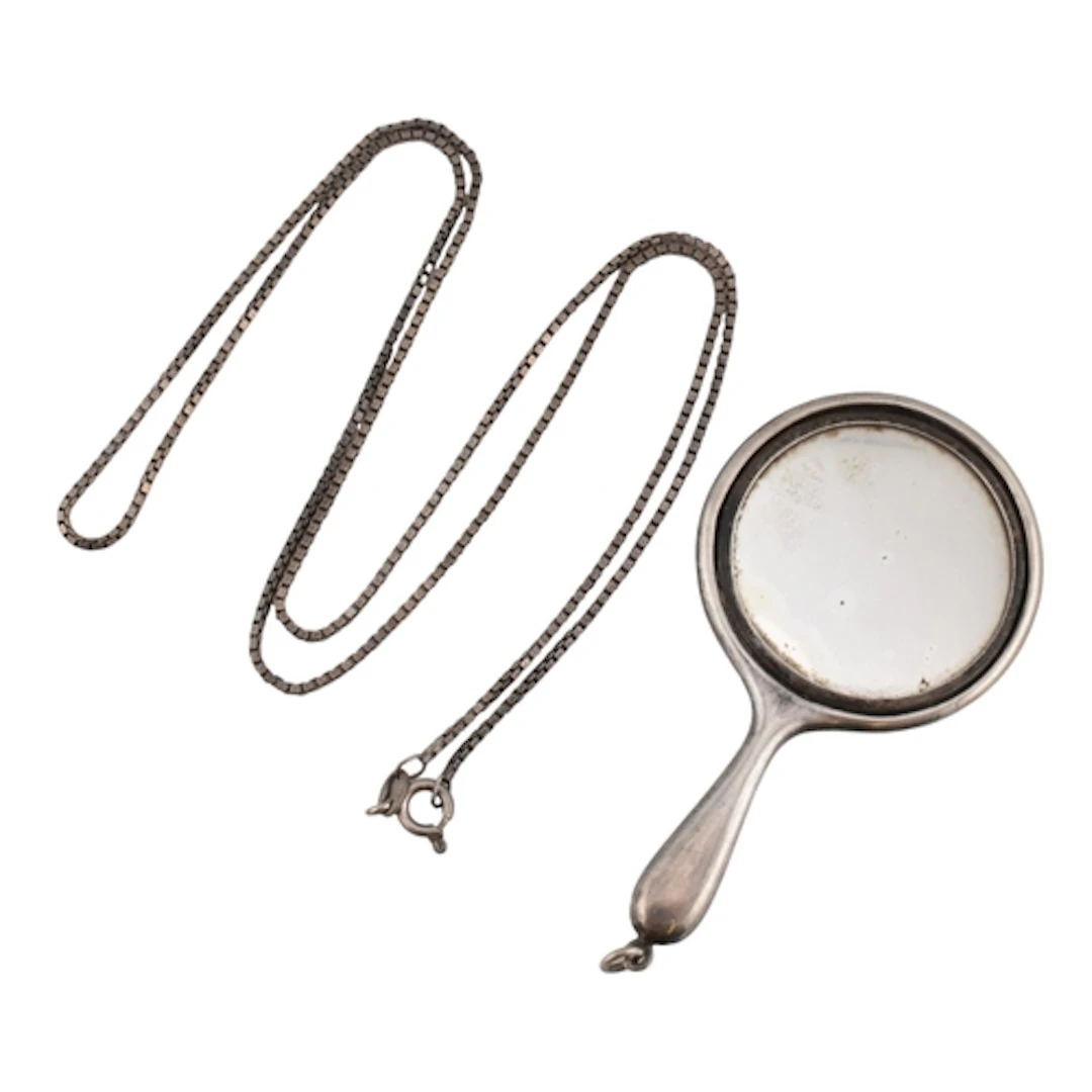 An Italian silver chain strung with an early 20th century si...