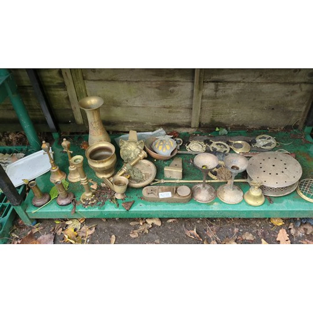 A quantity of brass and mixed-metal objects, including candl...