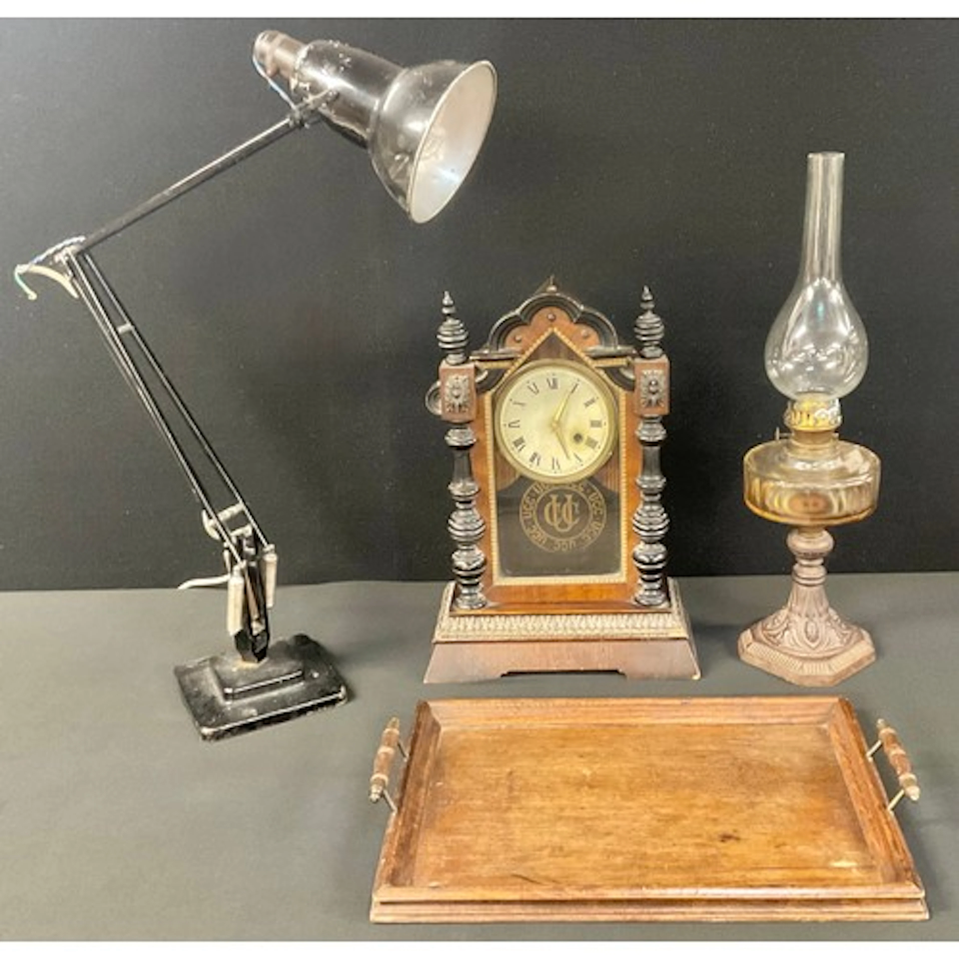 A Herbert Terry angle poise lamp, black arms, cast marks; o...
