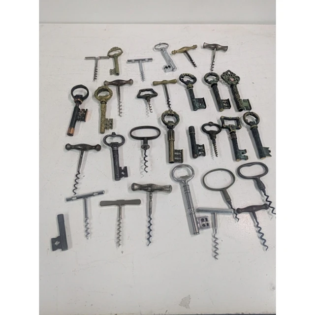 A collection of vintage corkscrews mainly fashioned as keys ...