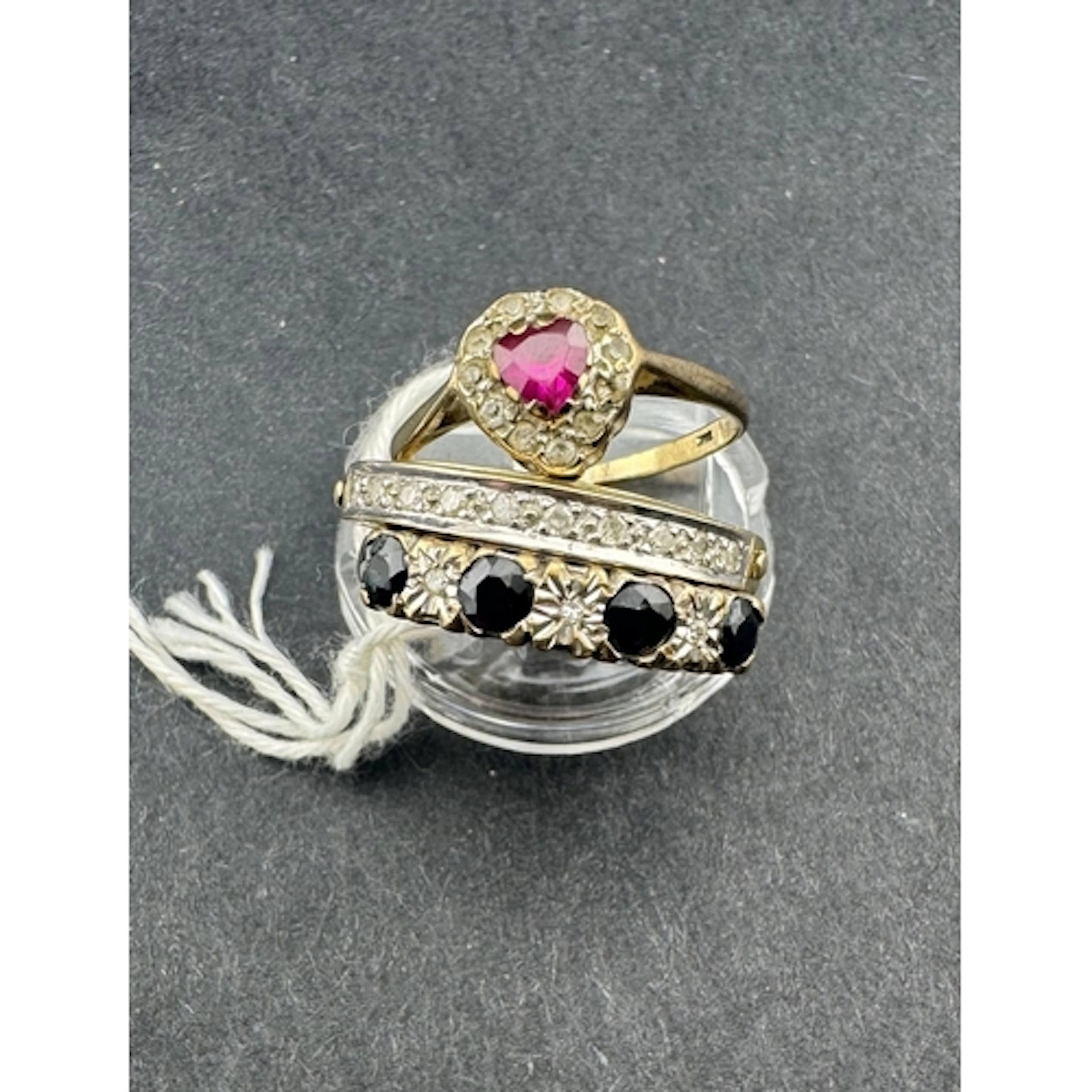 Jewellery: Jewellery: a 9ct gold ring set with a row of alt...