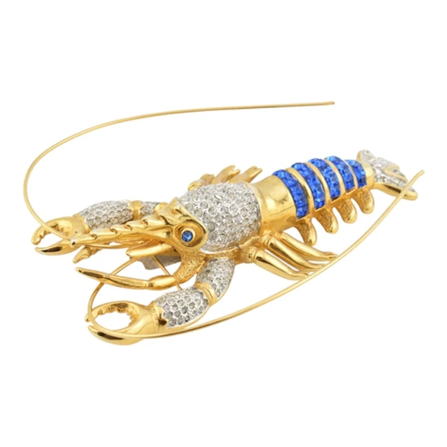 A huge gold tone and blue and white stone gem set lobster br...