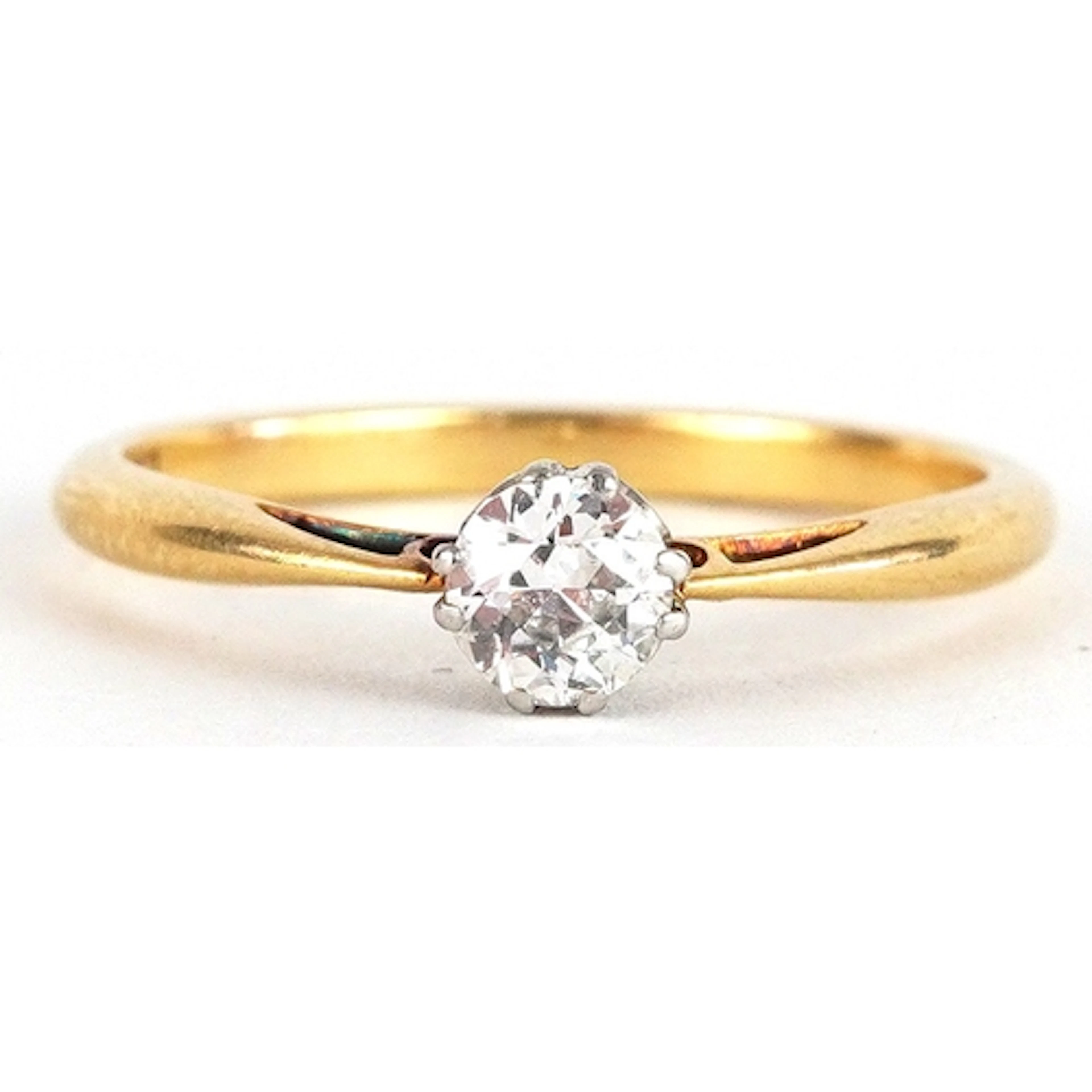 18ct gold and platinum diamond solitaire ring, the diamond a...