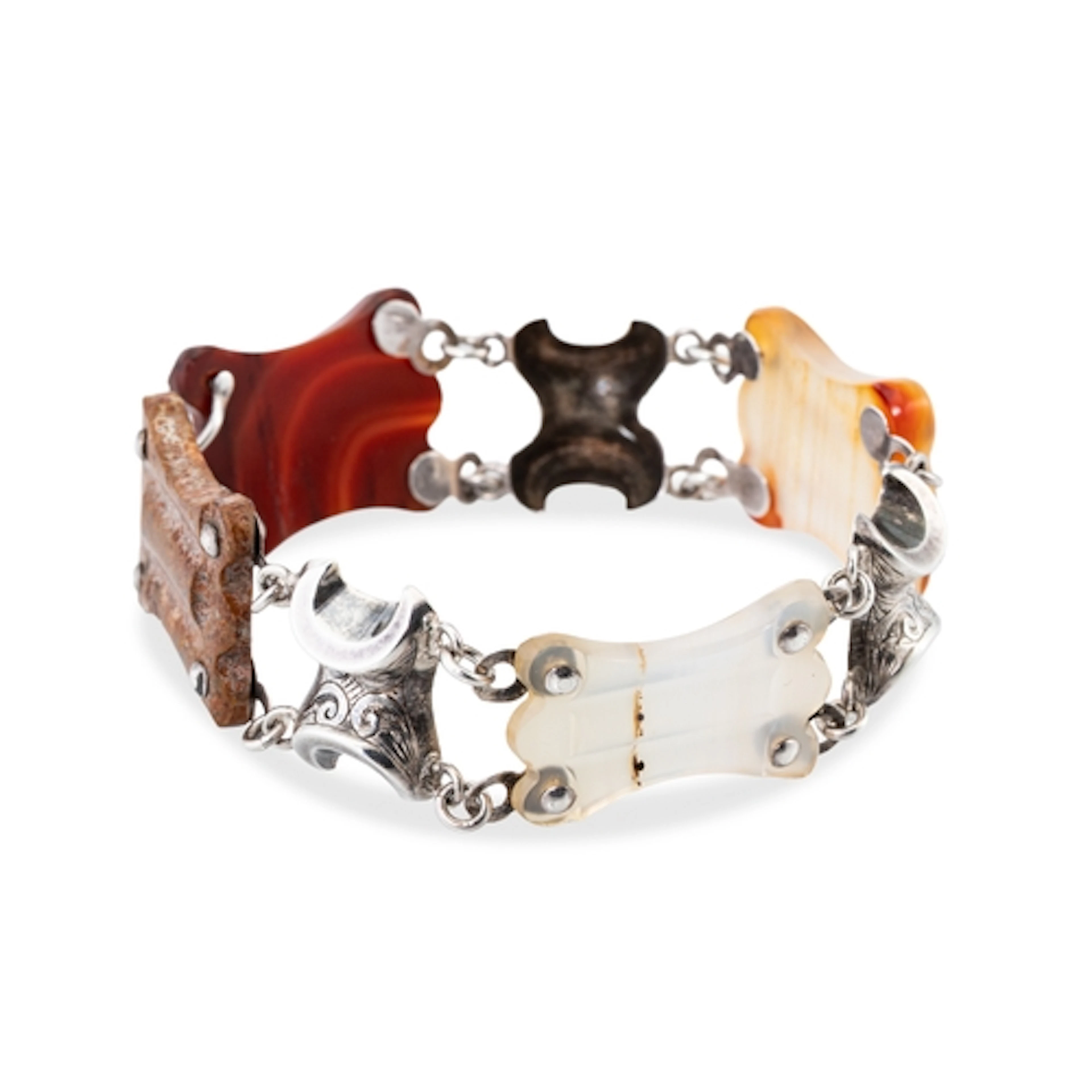 A LATE VICTORIAN SCOTTISH REVIVAL AGATE BRACELET, the shaped...