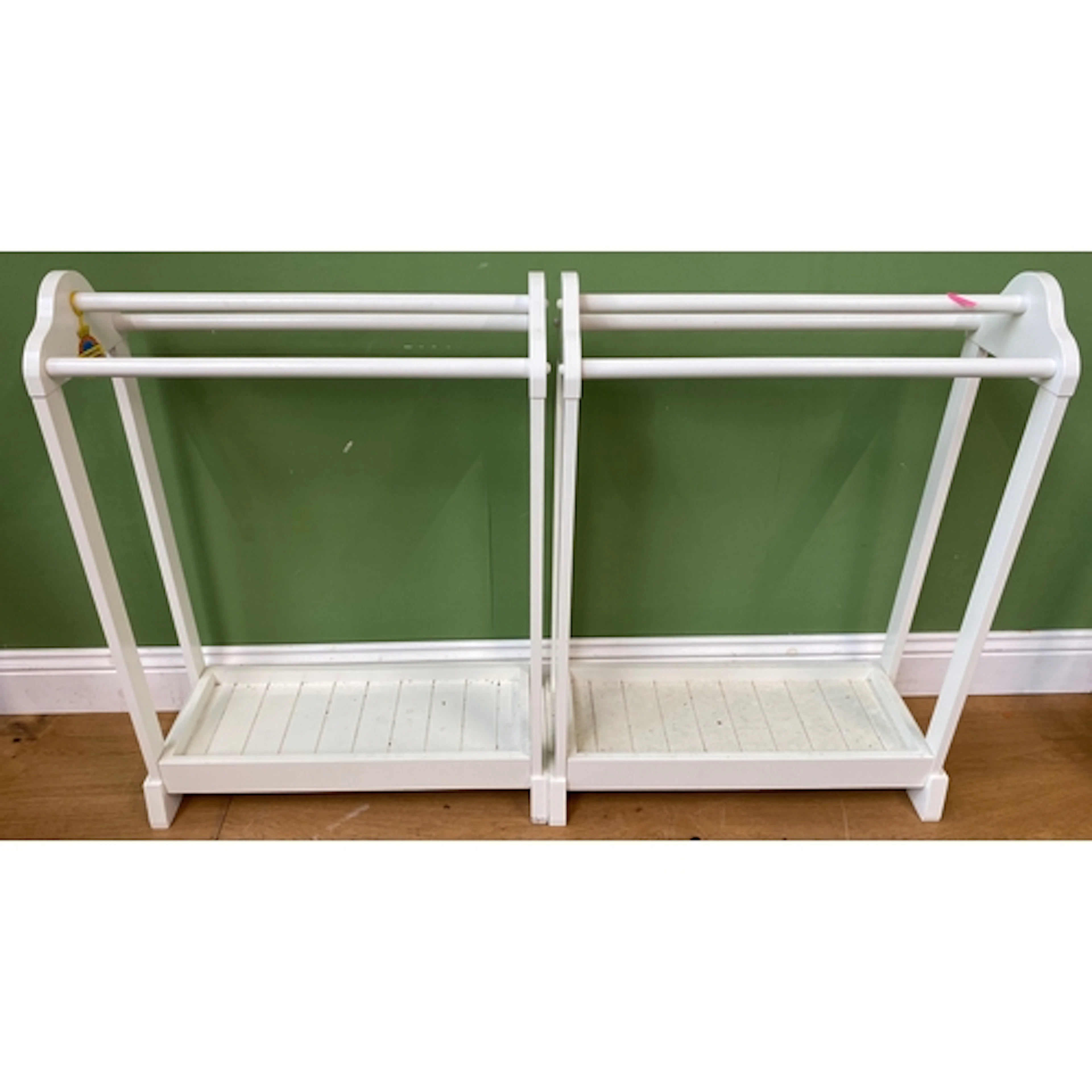 A pair of modern white painted towel rails, 67cmW